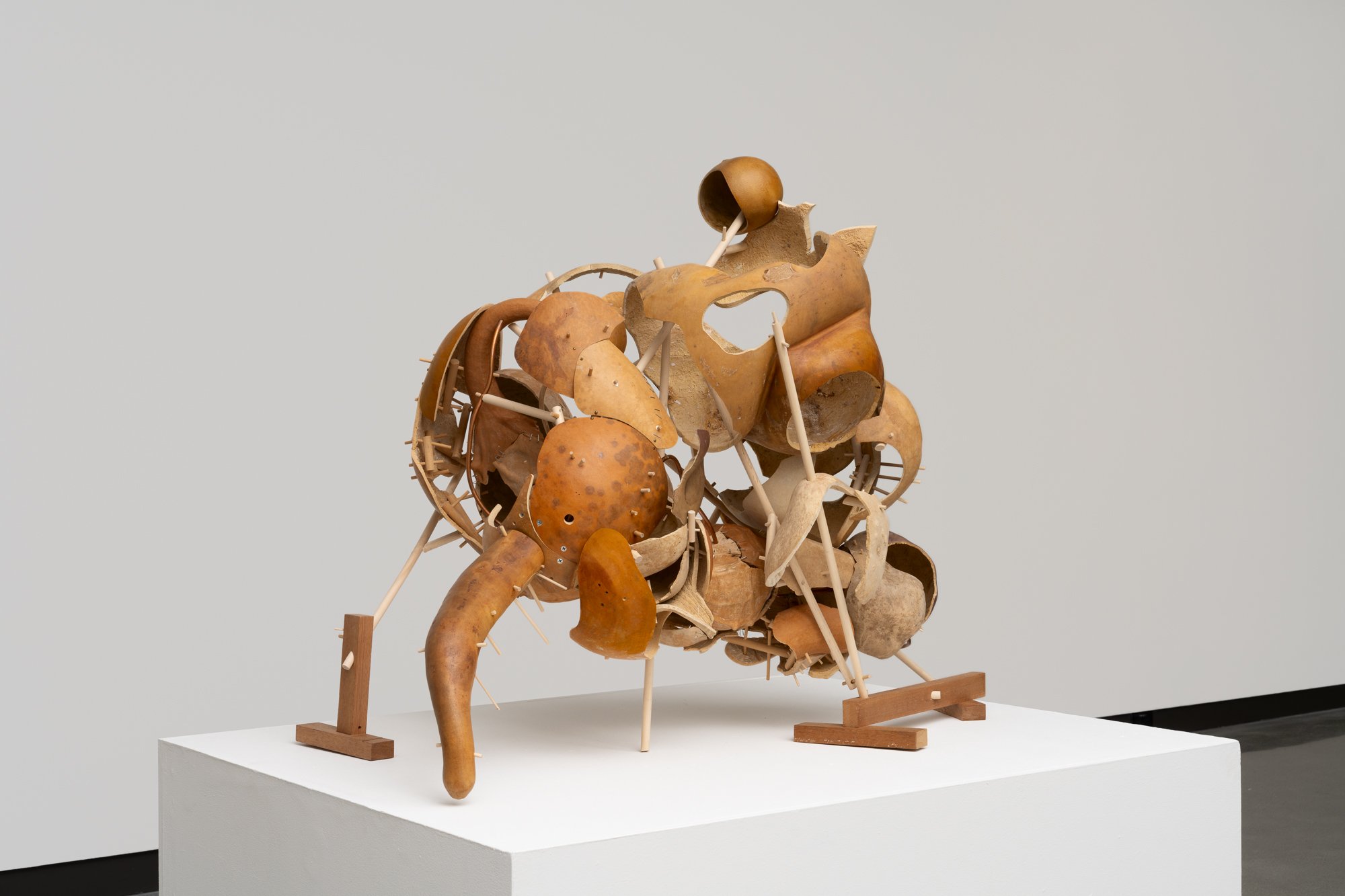 sculpture made of gourds on a podium