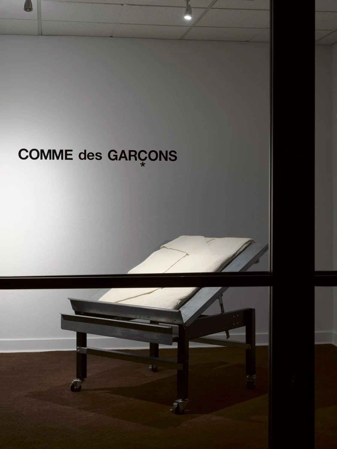 a white sweater on a produce stand