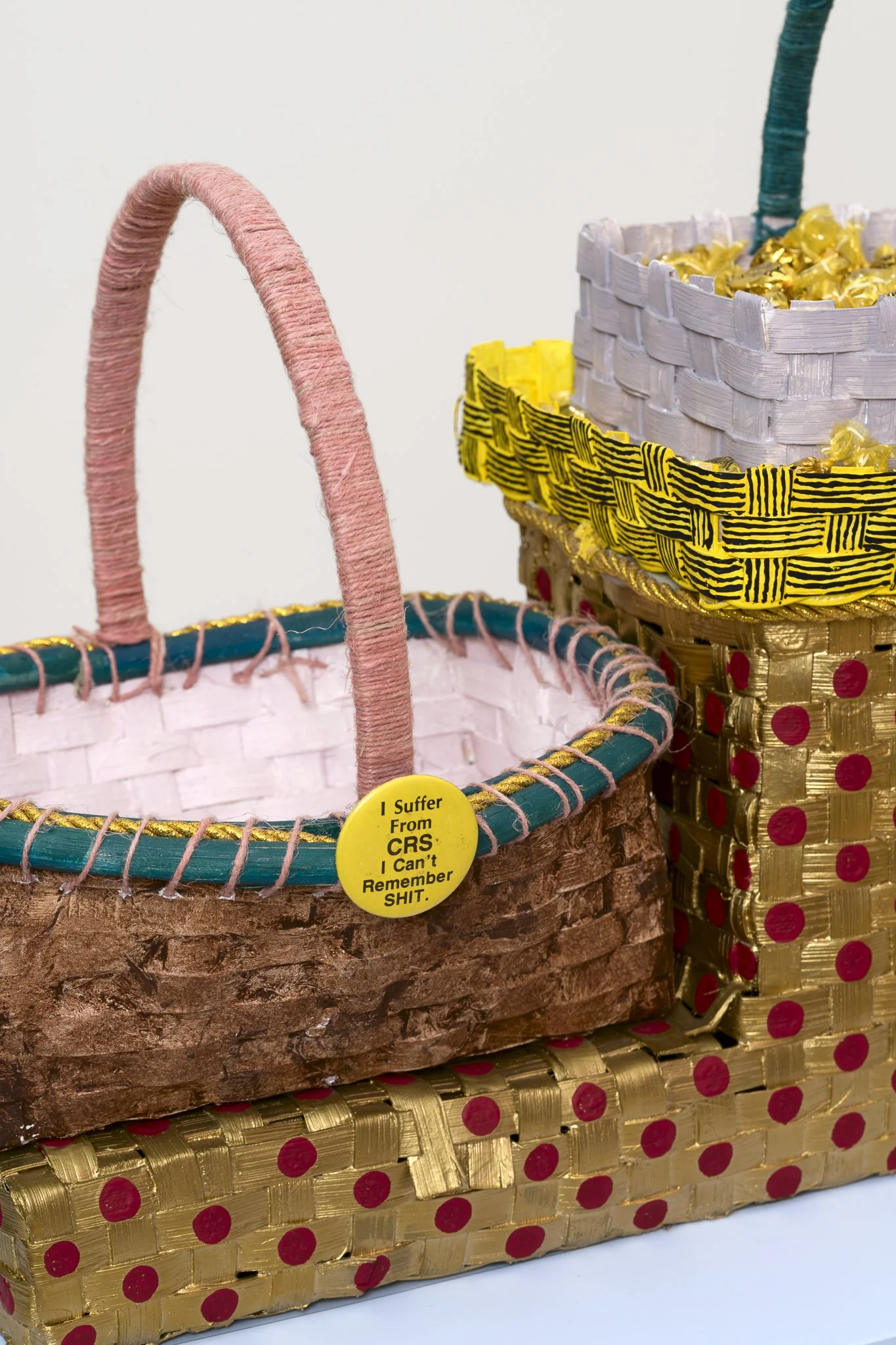detail of two baskets on a blue podium