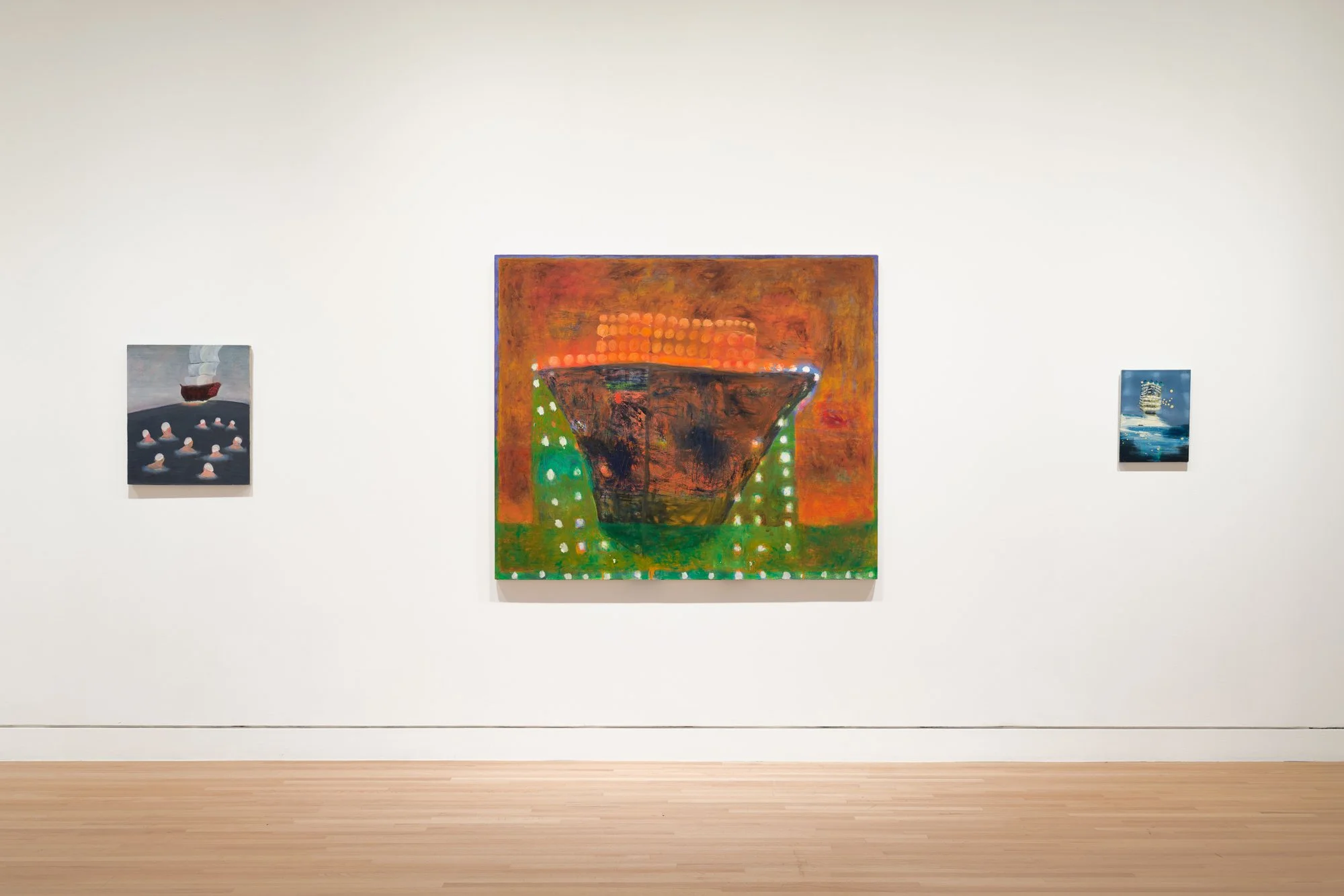 three colorful paintings on a white wall