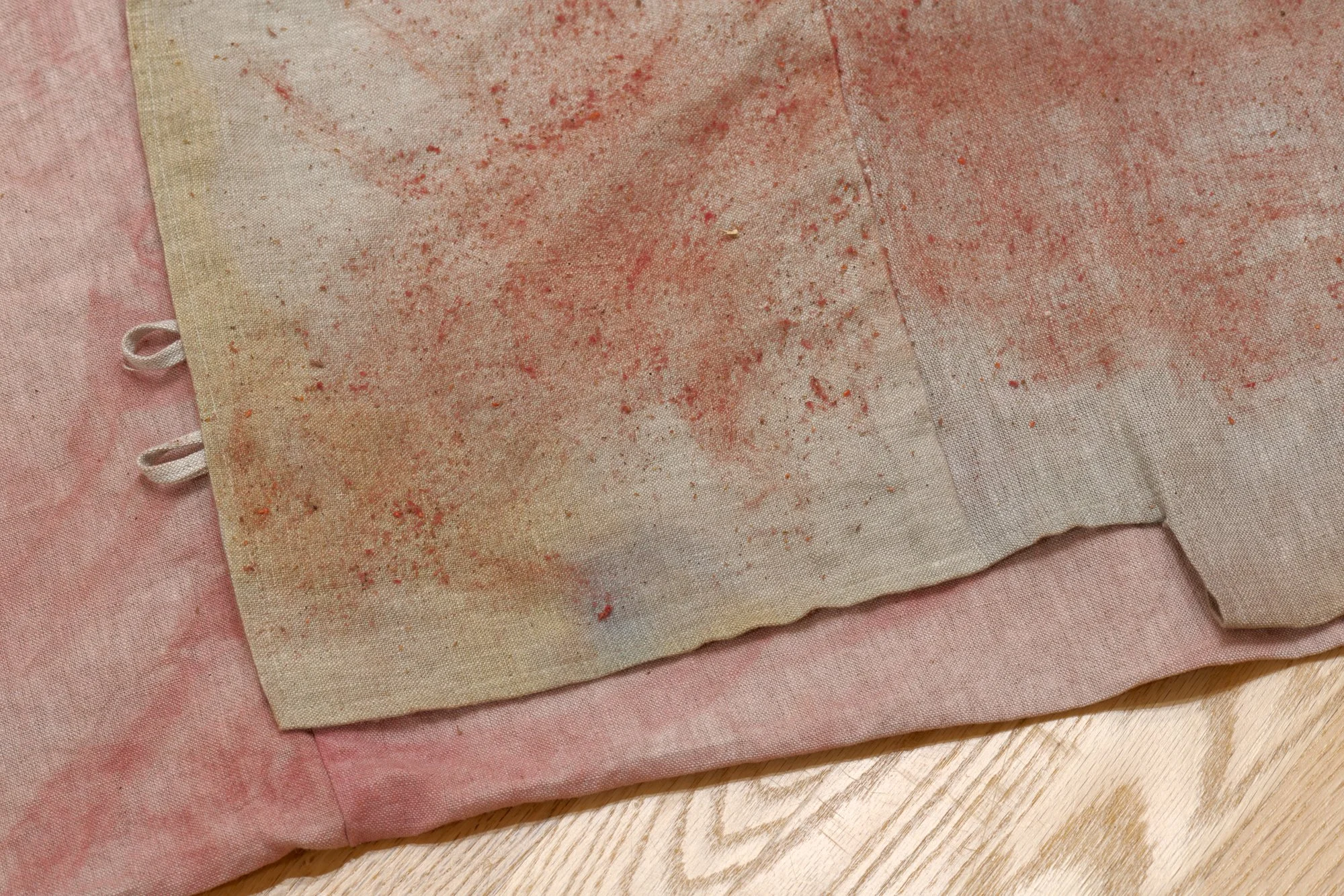 detail of a piece of pink and tan textile