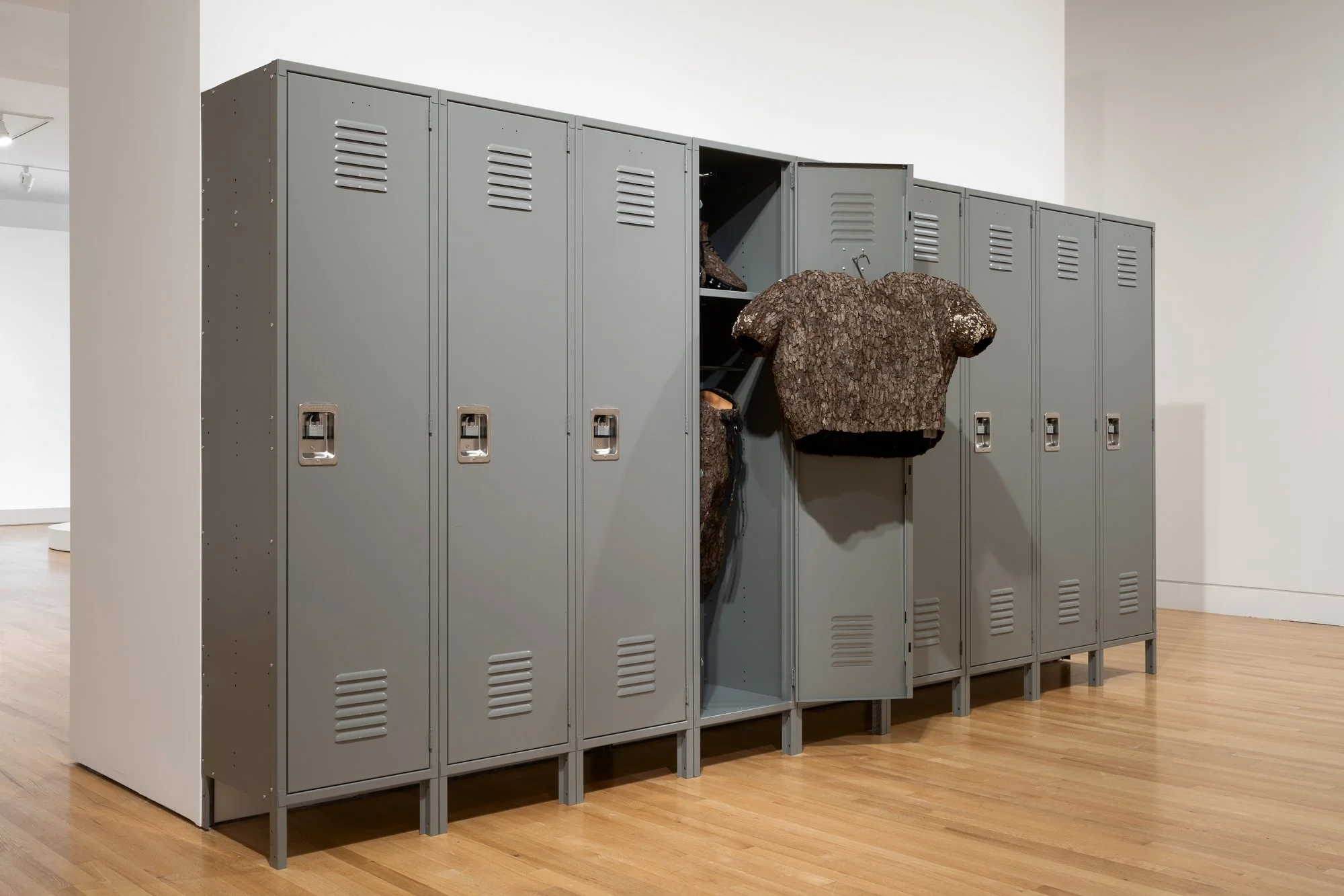 a roll of gray lockers with an american football jersey made with tree barks