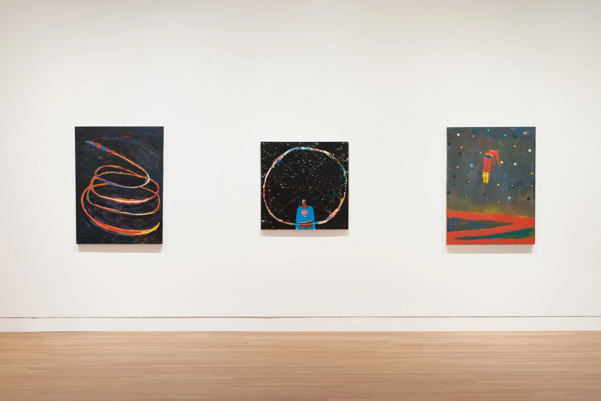 three paintings on a white wall