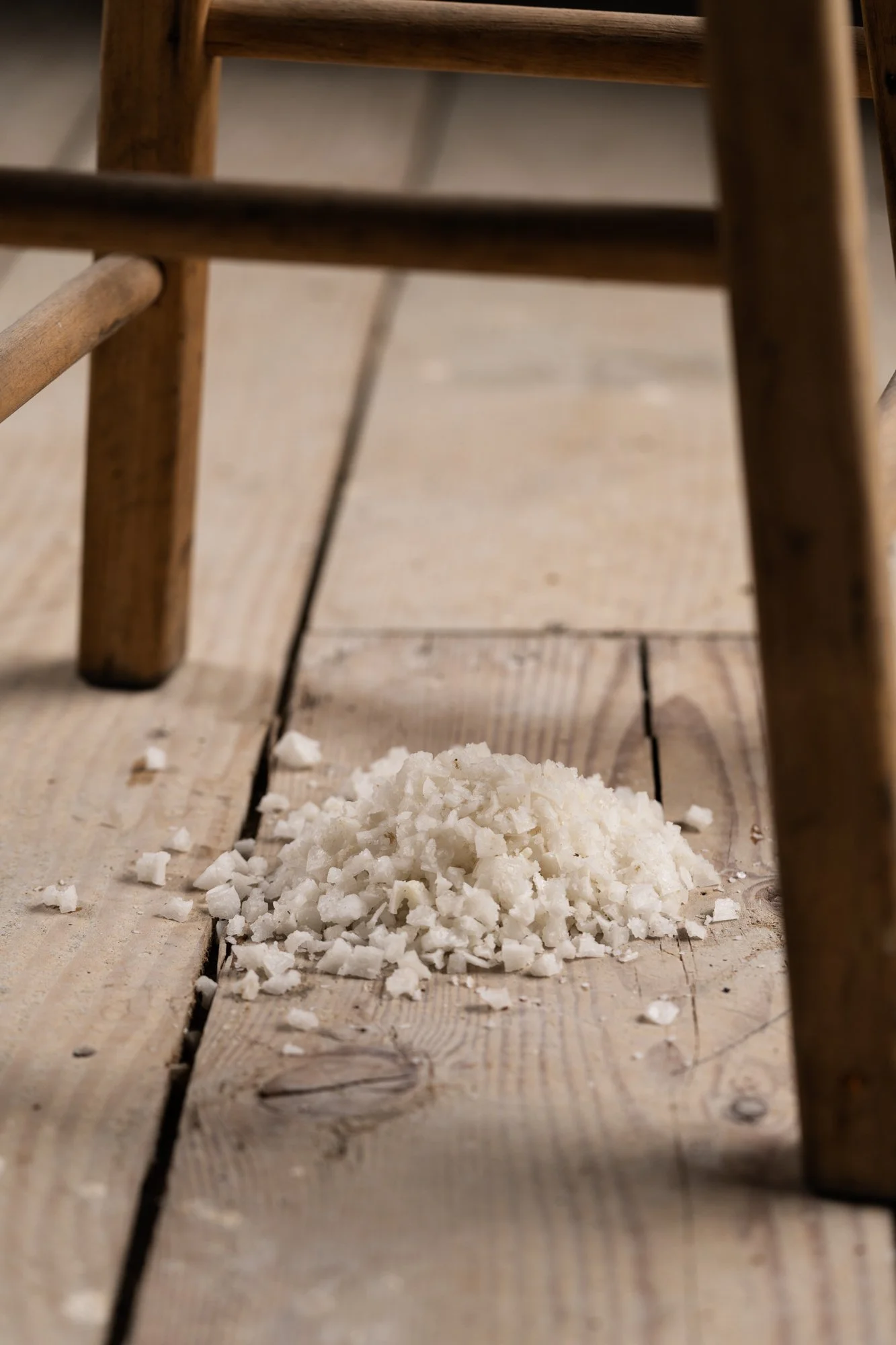 a pile course salt under a stool