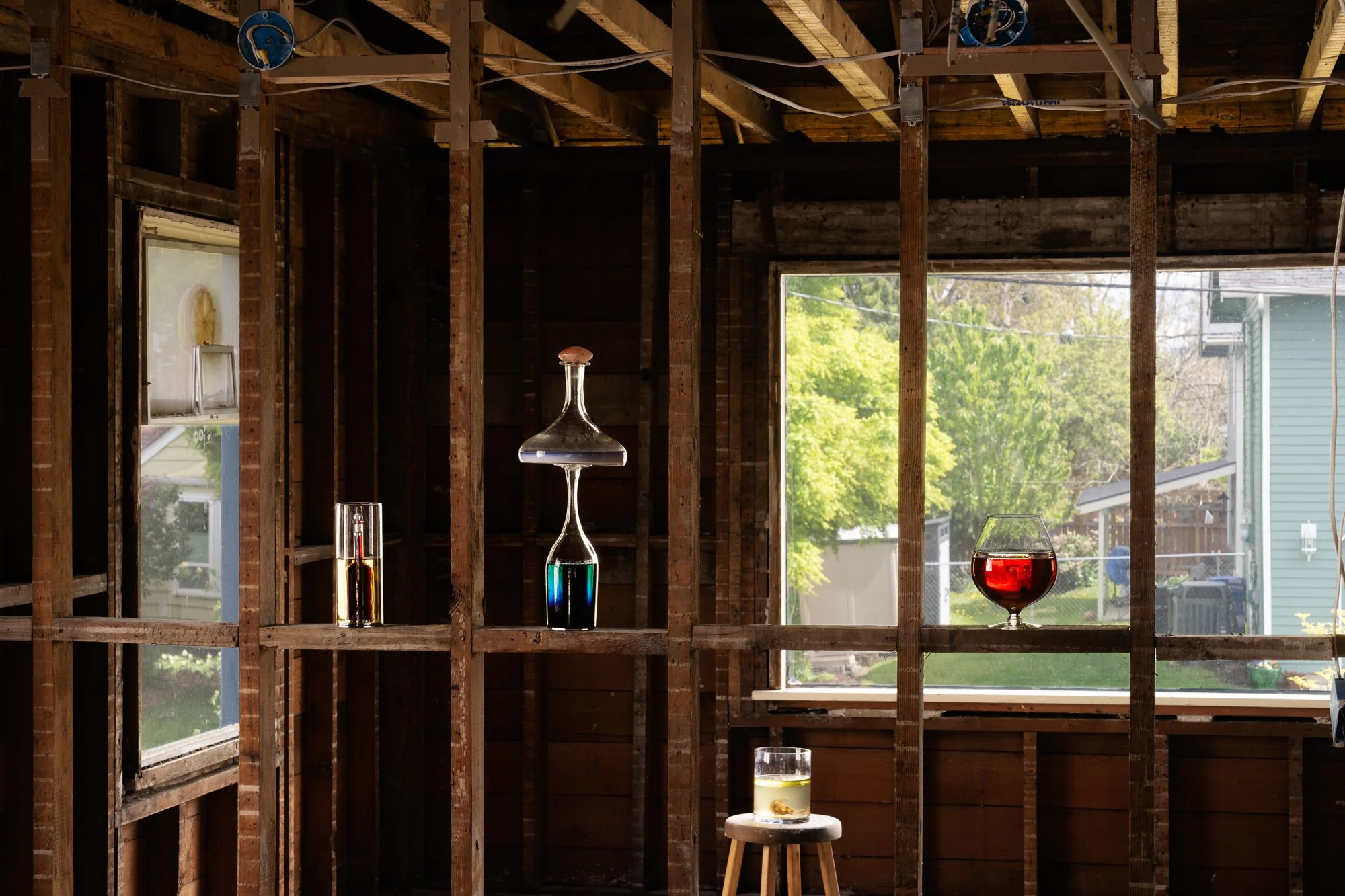 glass vessels with colorful liquids on studs