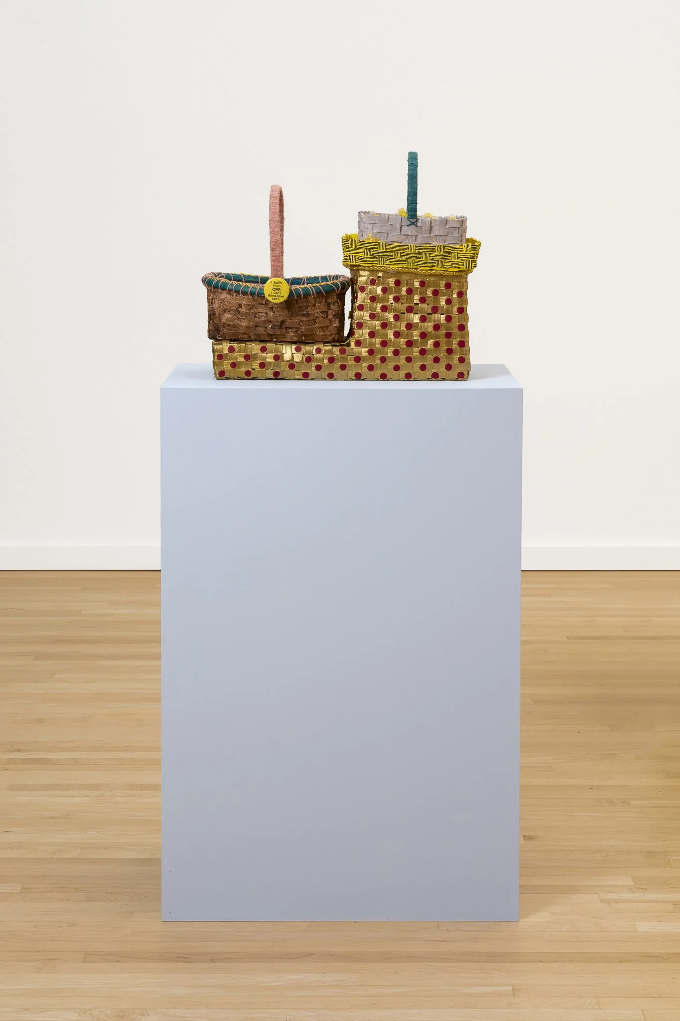 two baskets on a blue podium