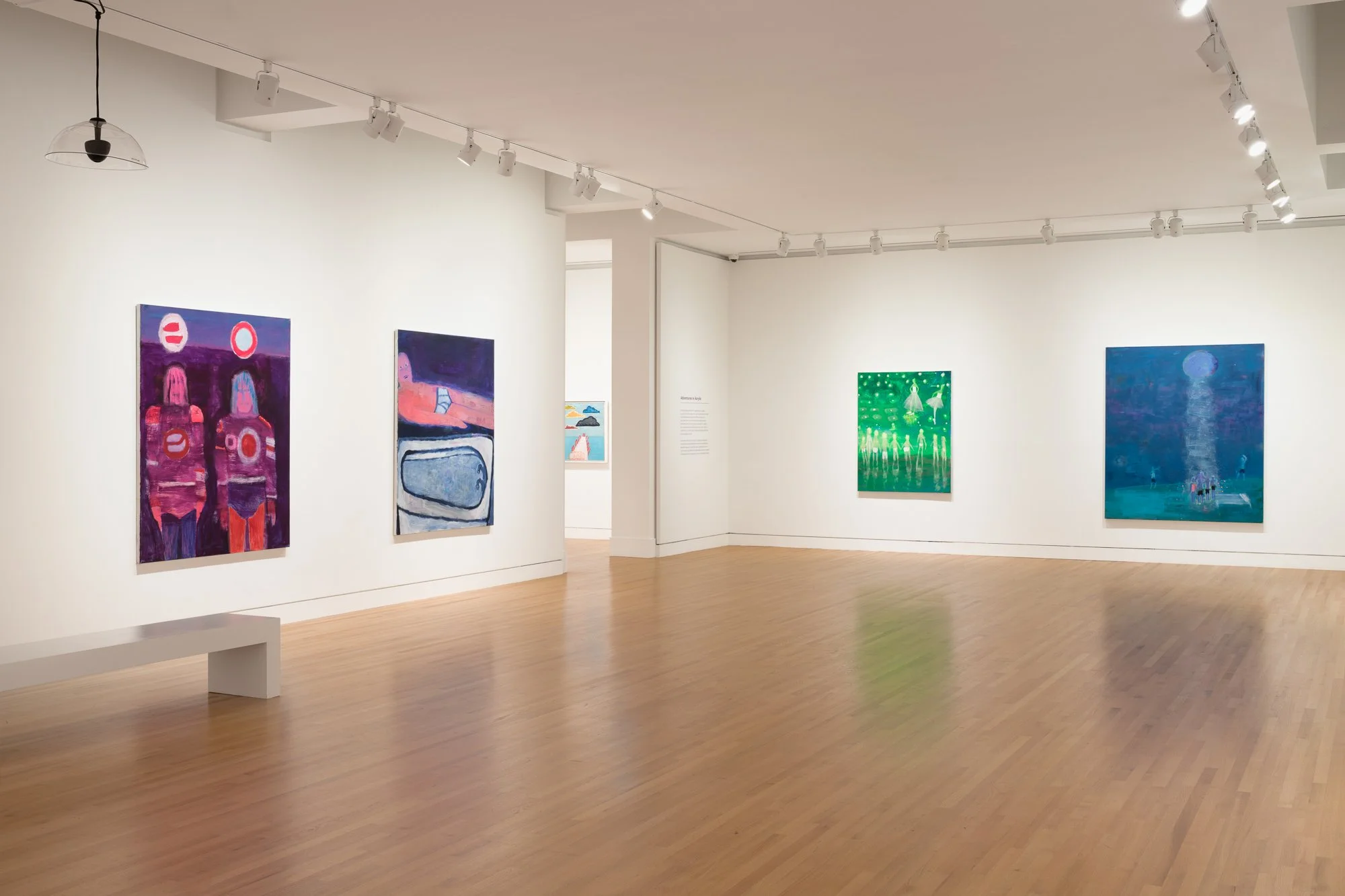 colorful paintings in a gallery