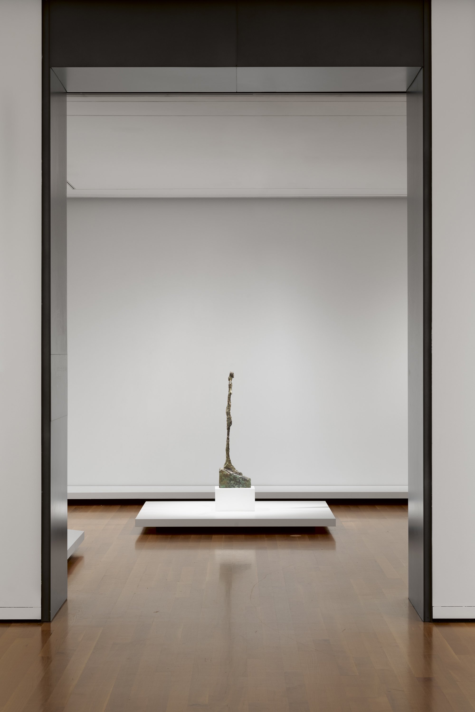 a sculpture shown through a doorway