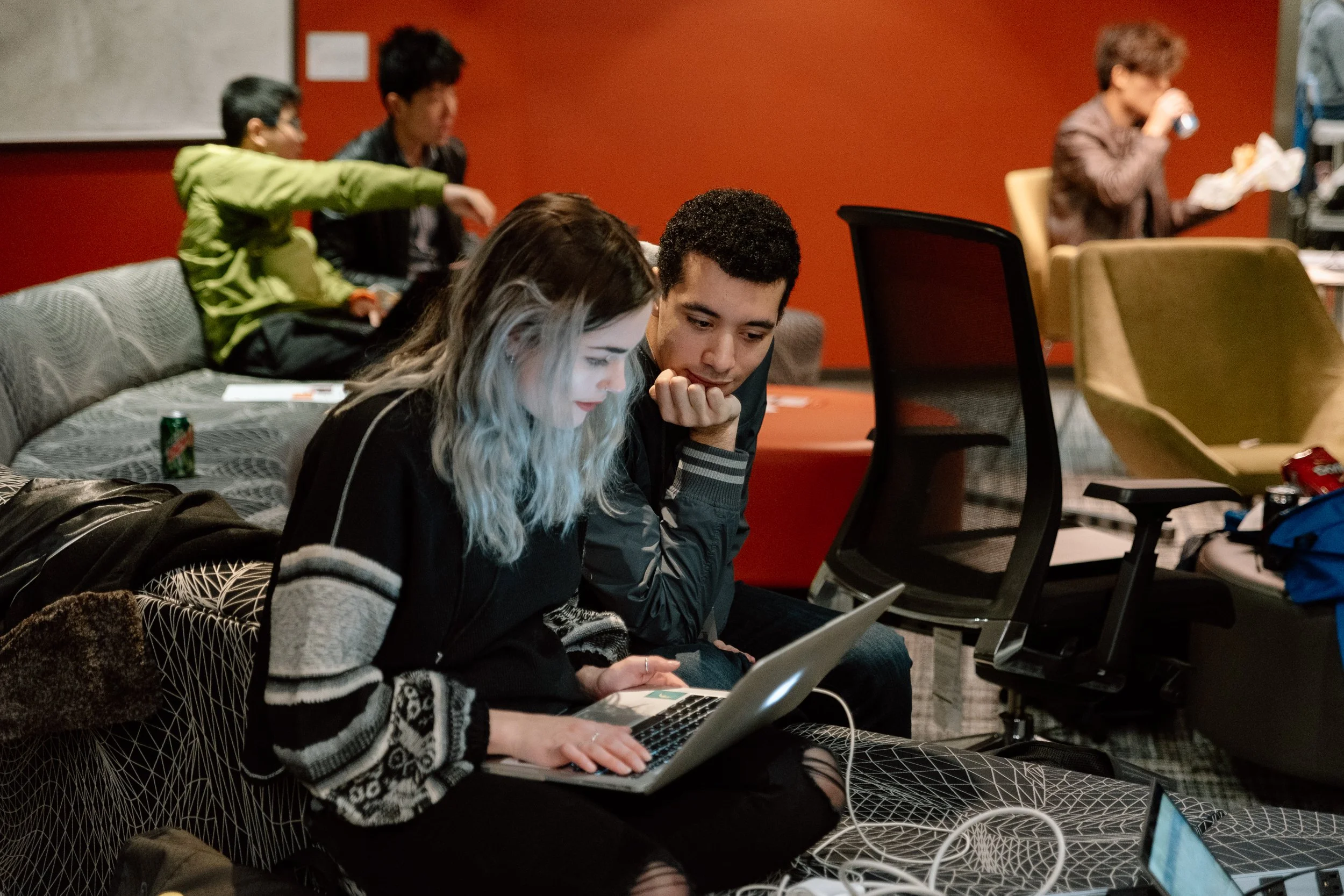two people looking at a computer at a Microsoft HQ event