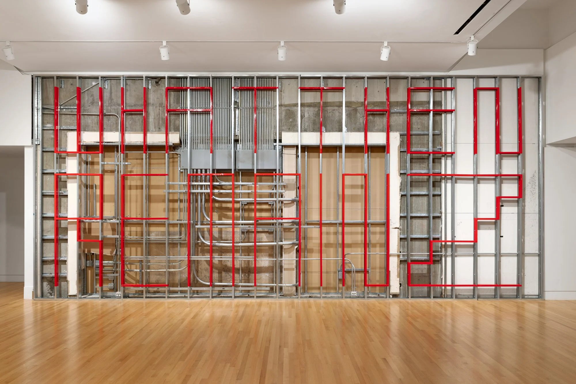 red paint on bare metal stubs reads "WHAT THEN REMAINZ"