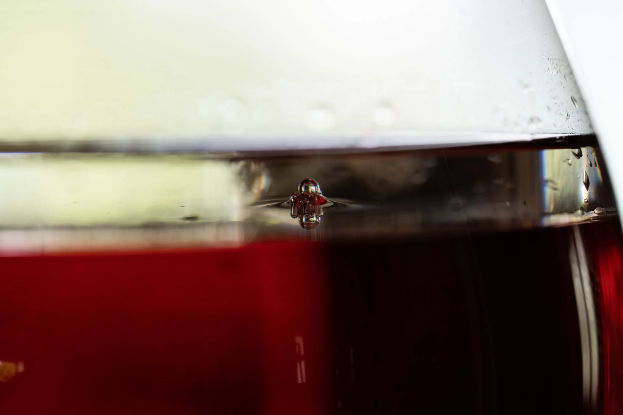 detail of a sculpture made of glass vessels and colorful liquids