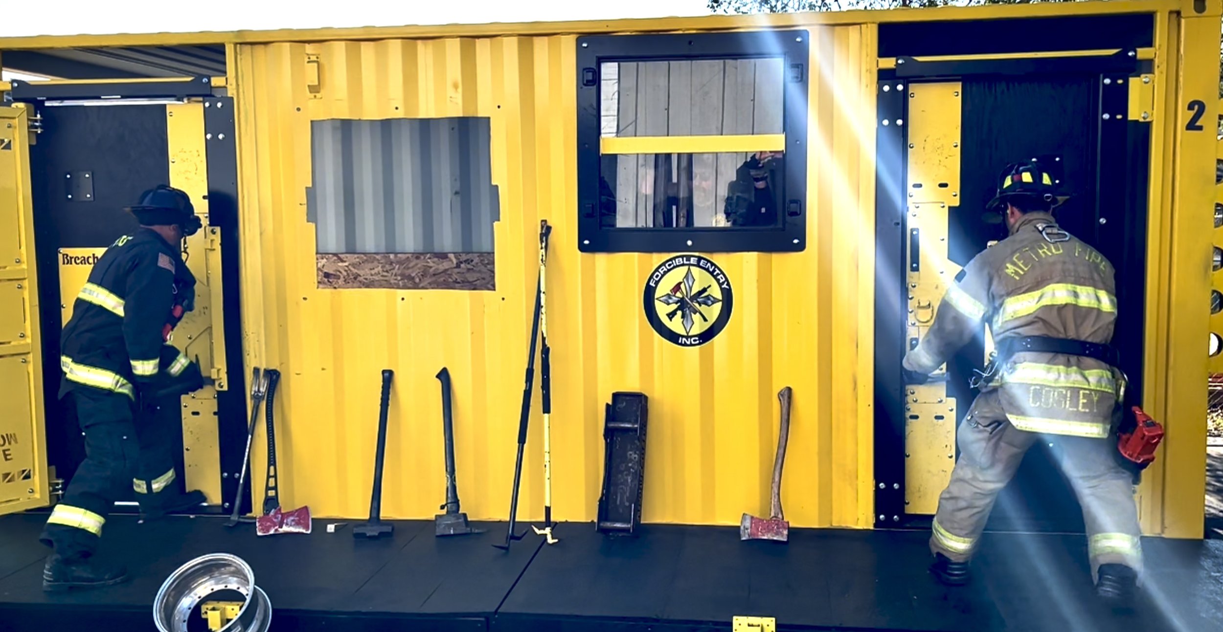 Firefighters Breaching the Forcible Entry, Inc. - Conex Box Training Center