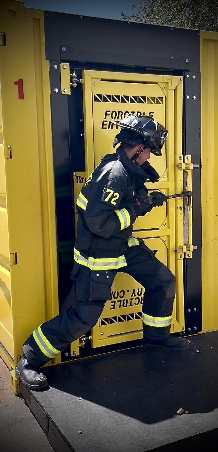 Firefighter Forcing Entry on a Security Screen Door Prop