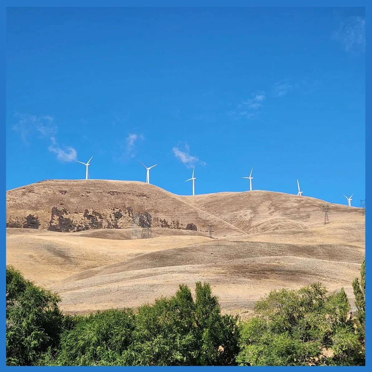 Windmills Capturing Energy at the End of the Sky