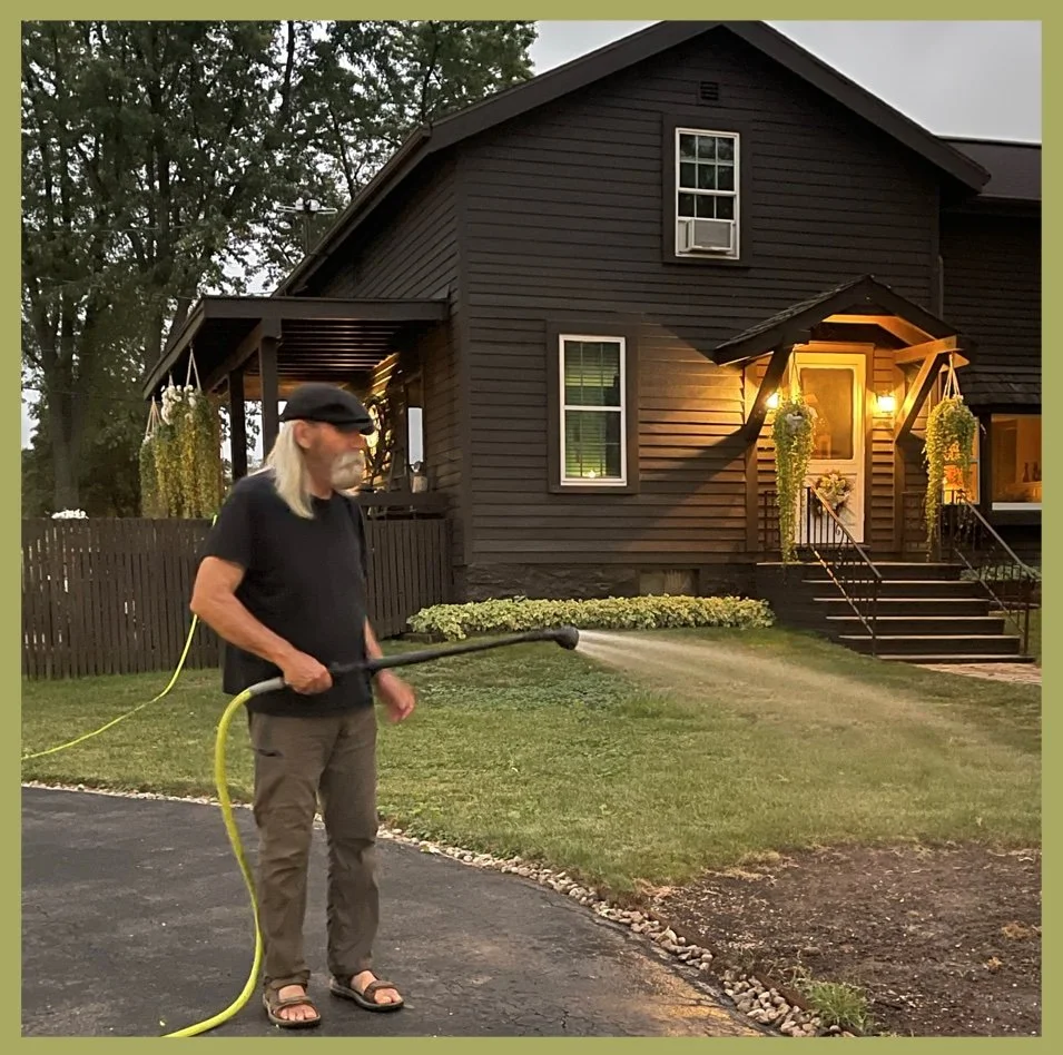 Watering His Grass Seed