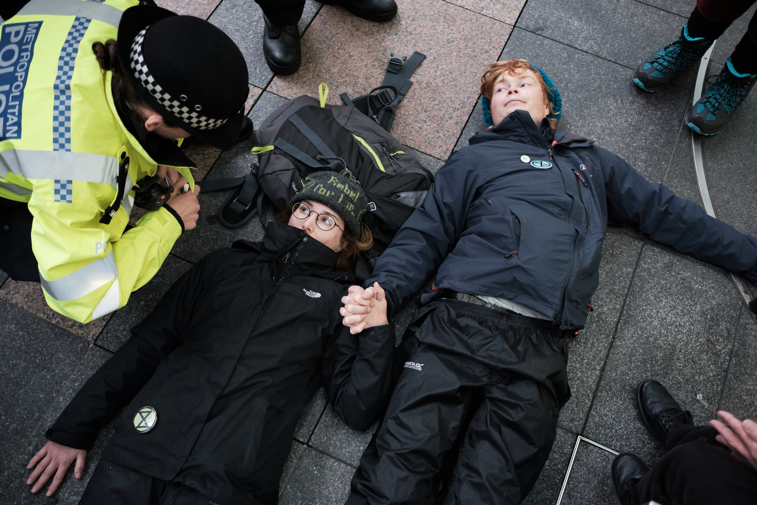  Activists glue themselves to the front entrance of Barclays Headquarters in Canary Wharf. Barclays is the sixth largest provider of financial services to the fossil fuel industry in the world and first in Europe. Unlike many others UK banks, Barclay
