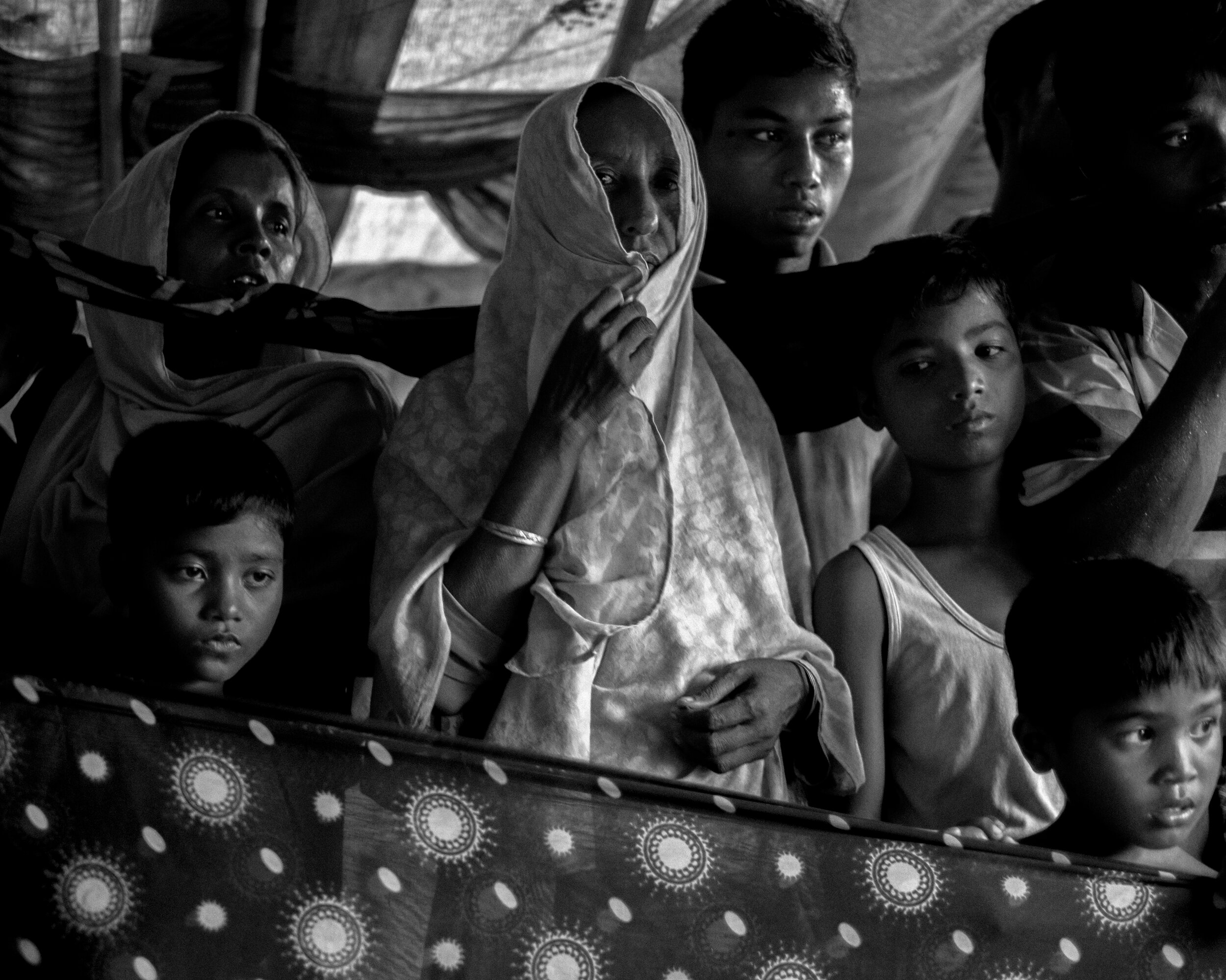  Under a tent in the Shafiullah Khata refugee camp, Rohingyas testify about the atrocities they have suffered in Myanmar.  