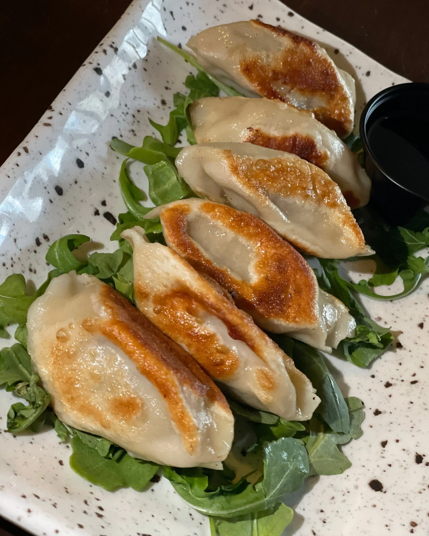 Crispy, savory, and perfect for snacking! 
Our pork potstickers with soy dipping sauce are calling your name! 🥟✨