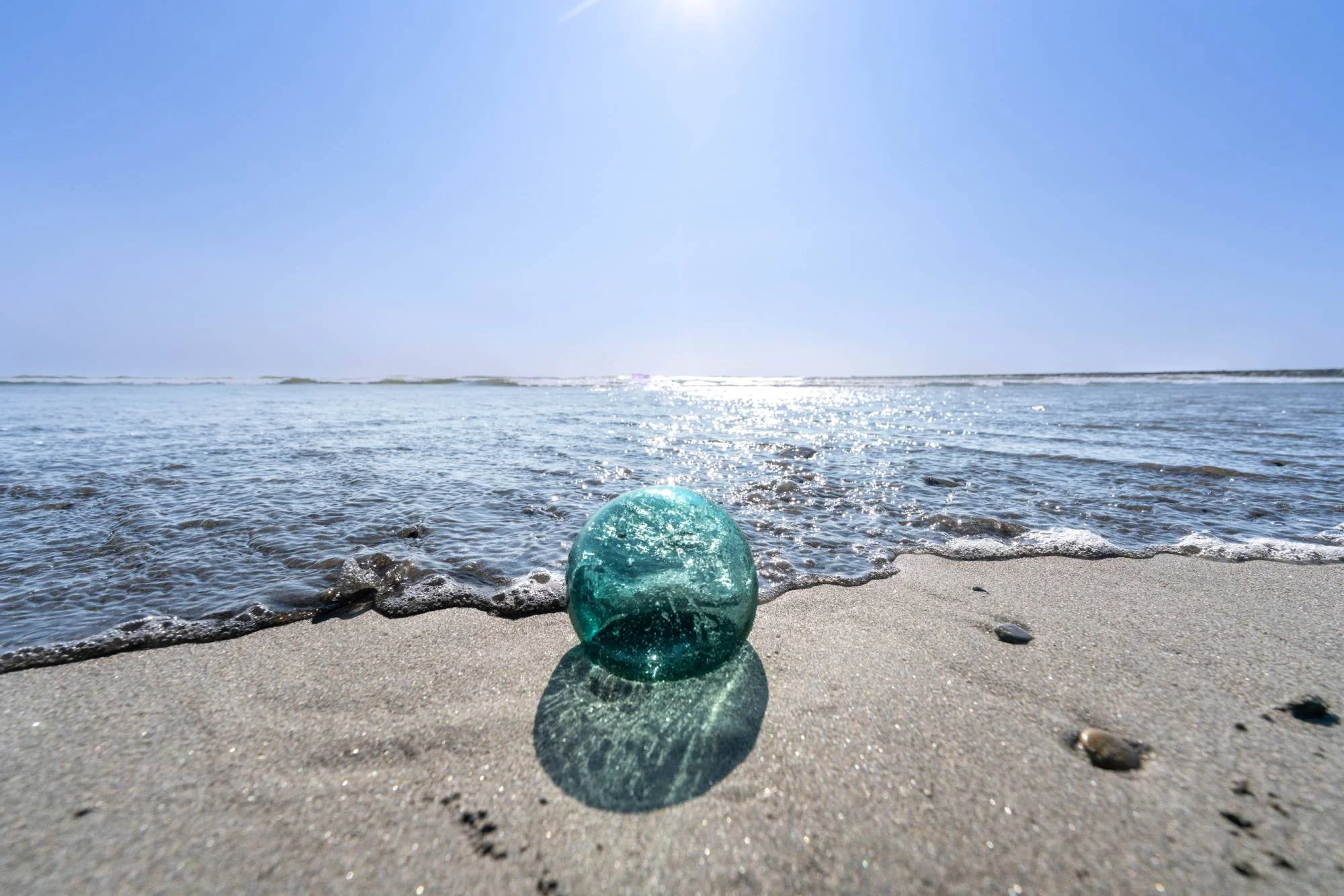 Glass float at tides edge