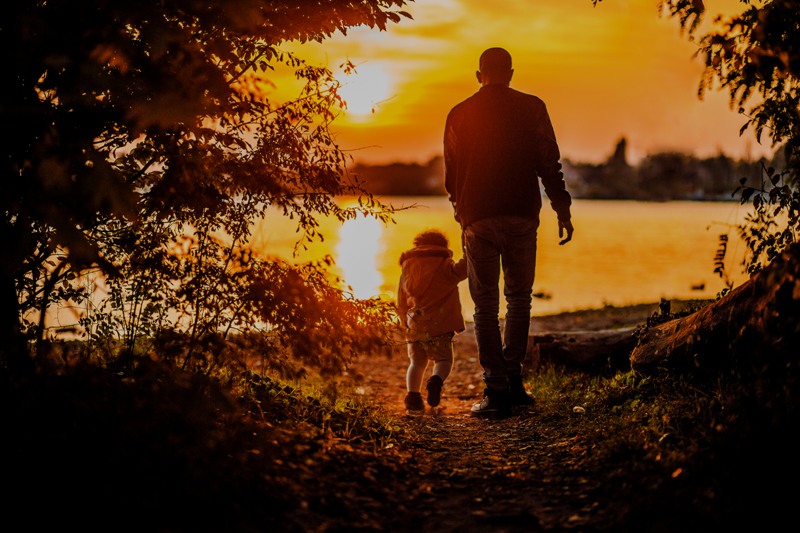father-and-child-walking-at-sunset.jpg