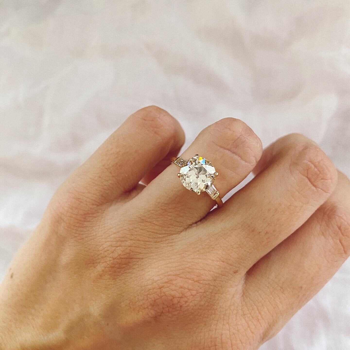One word came to mind when I saw this ring IRL for the first time - 🌹Romantic🌹 It could be the UNREAL antique Old European diamond center stone or the nod to Art Deco jewelry with the straight baguettes, but one thing&rsquo;s for sure: this ring is