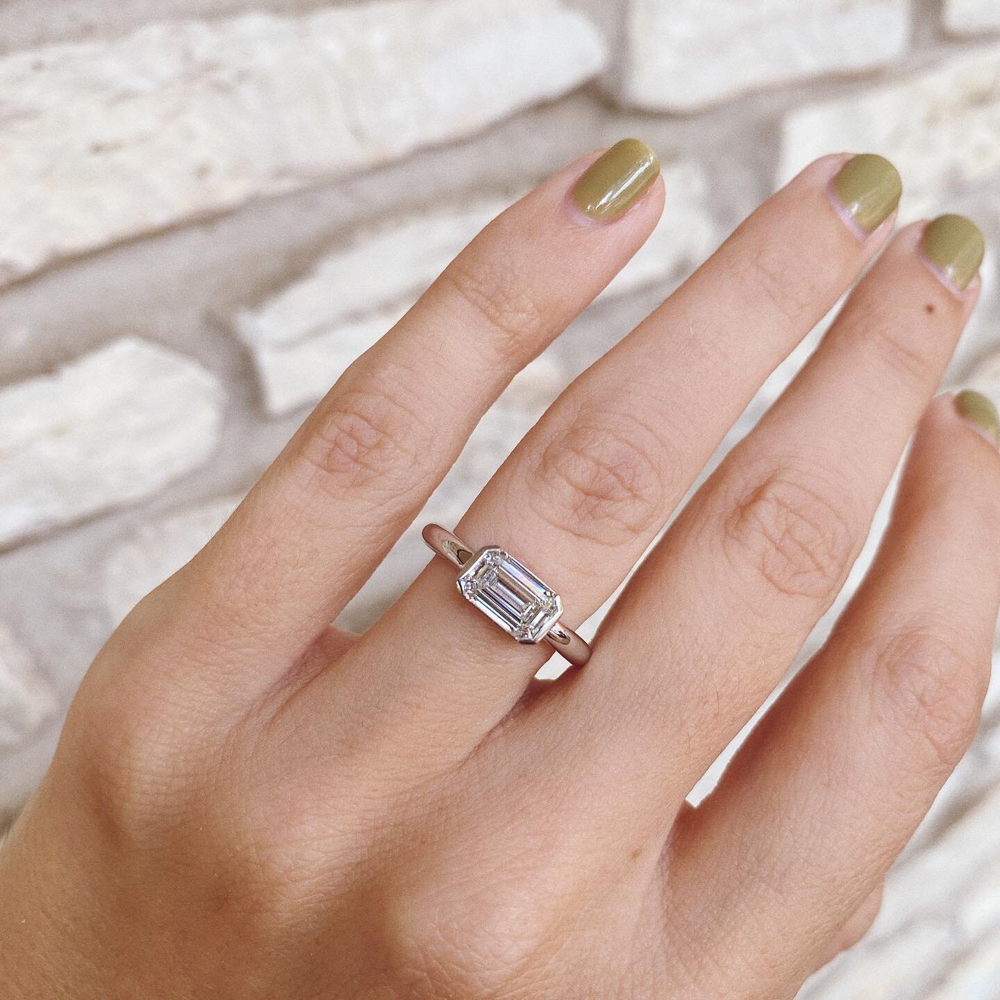 A simple simple redesign can make all the difference 😌 our client&rsquo;s emerald cut living her best life in a new @hine.nyc setting 😇 is it just me or do diamonds look bigger when set east/west?!