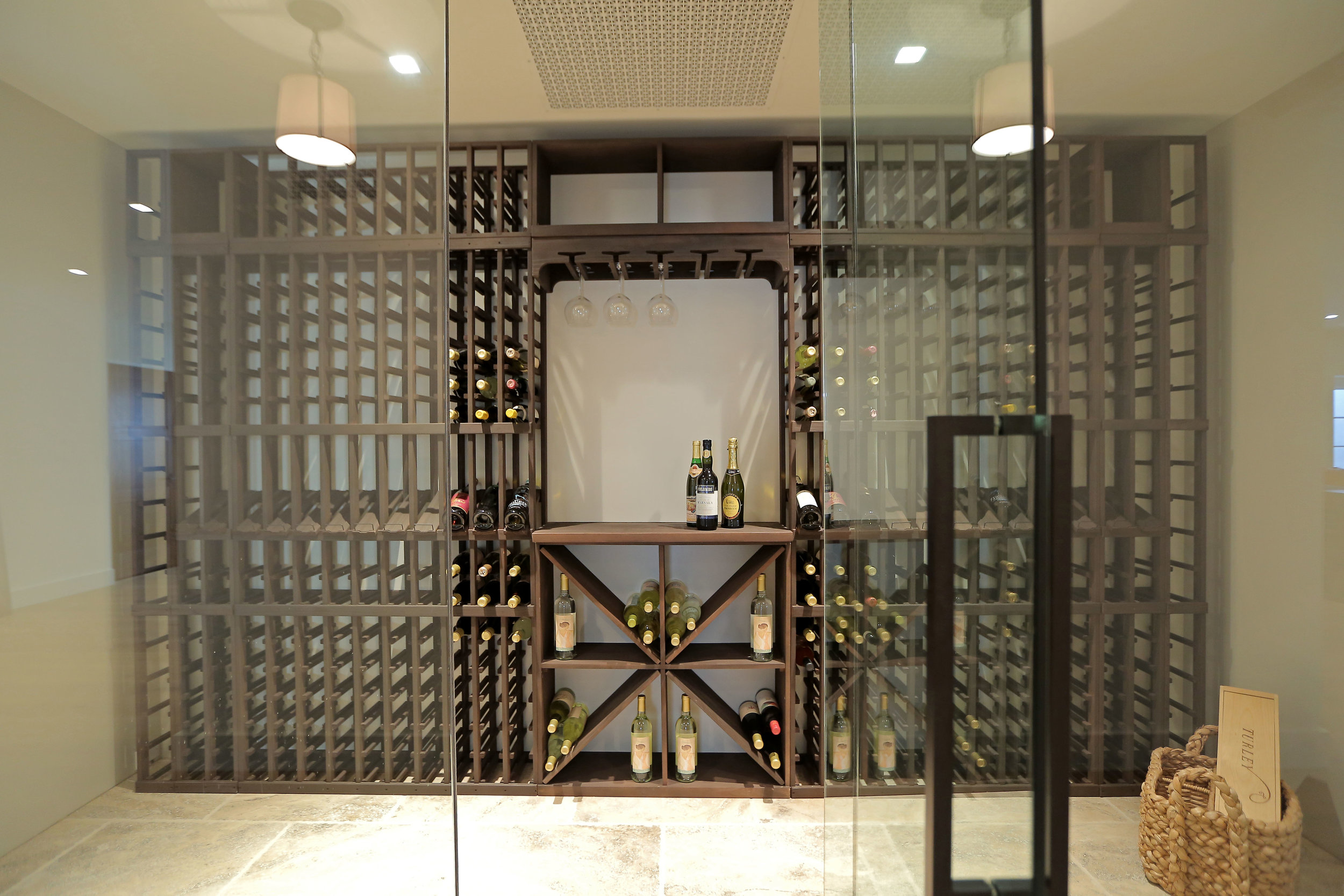 Modern wine cellar with glass doors.