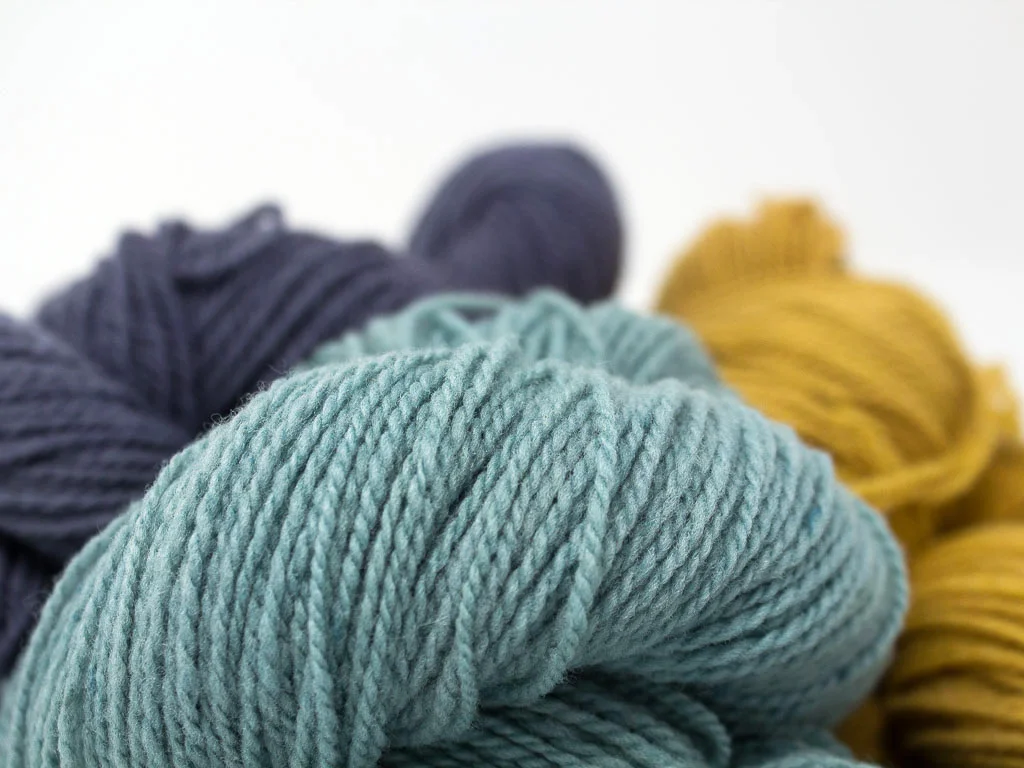 group of merino wool skeins, fingering weight