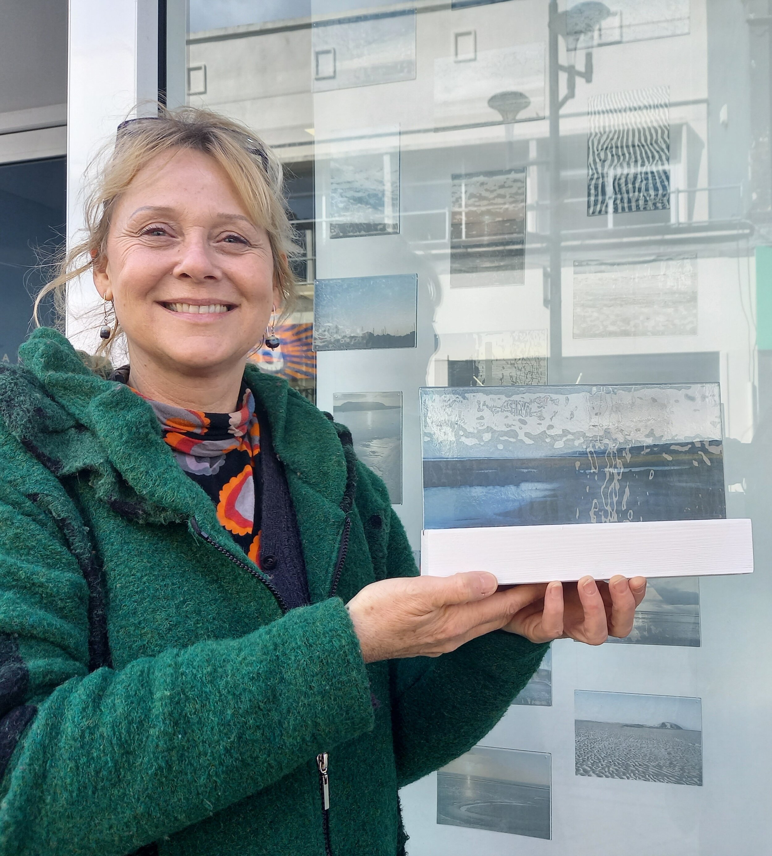 Copy of Artist Claire Hall with her glass postcard display at Optika Opticians.credit Culture Weston.jpg