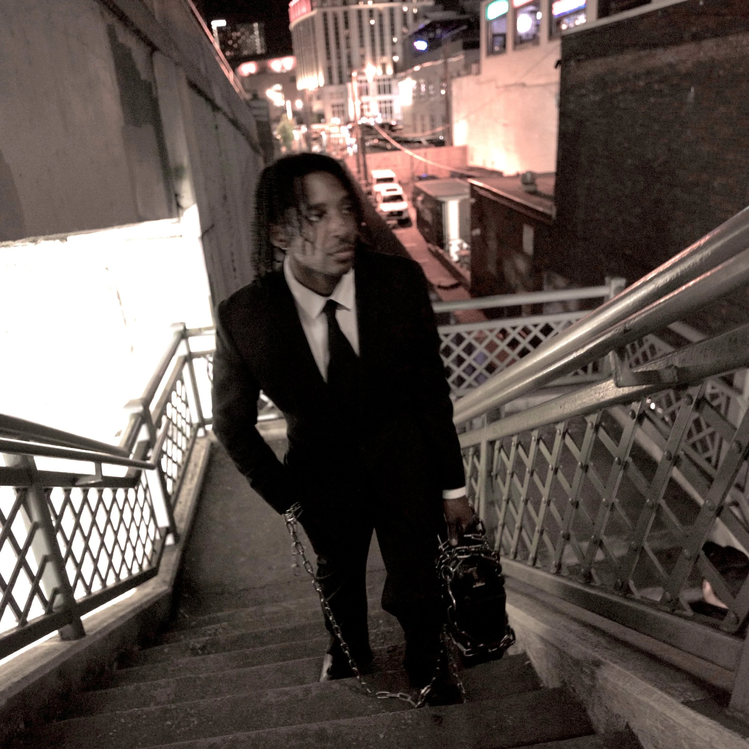 Seth Witcher Walking Up Stairs With Briefcase.jpg