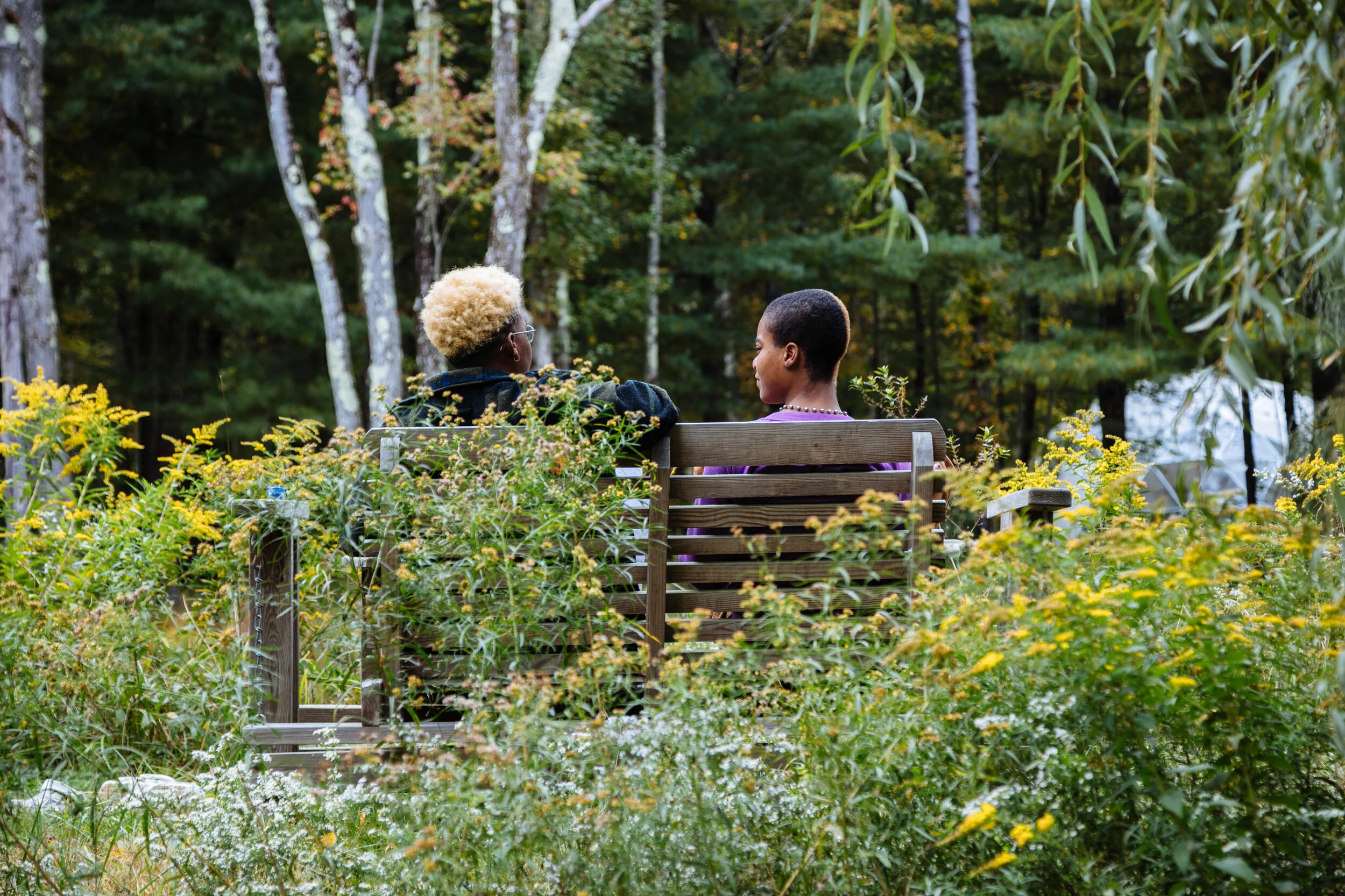Mo Romney and Kamra on a bench near the pond‚ photographed by Naima Green. Courtesy of Activation Residency.