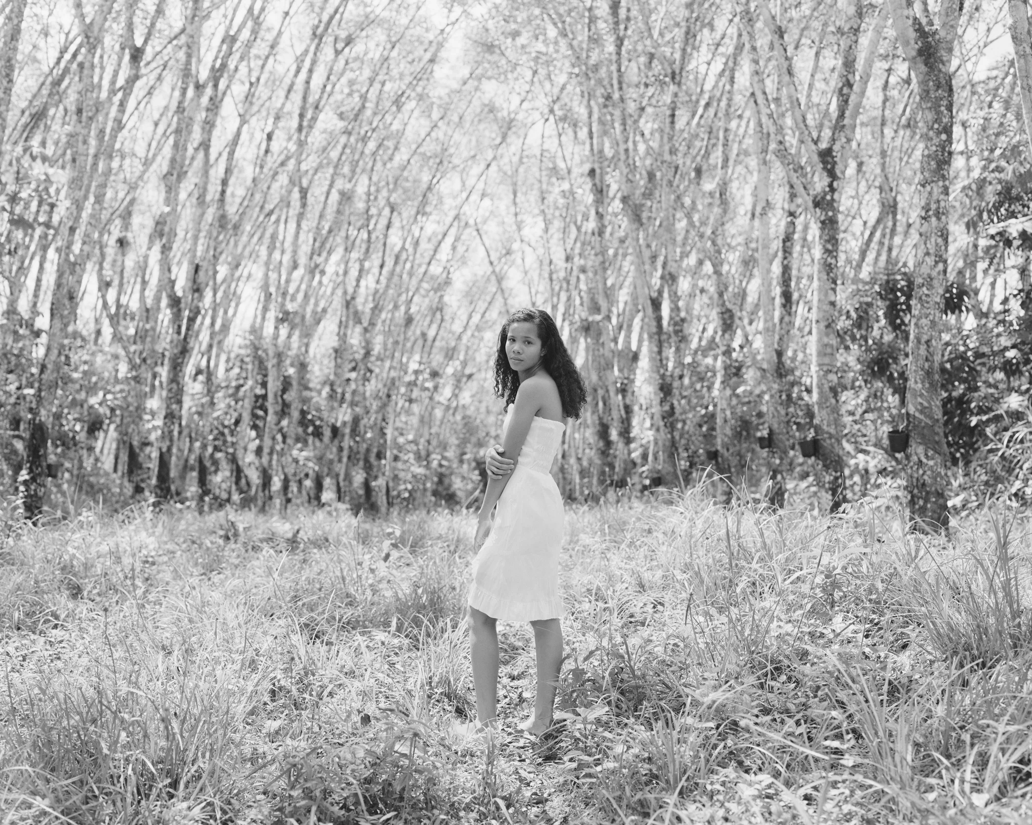 Emilly Farias in the Michelin rubber groves, April, 2014, Michelin Rubber Plantation, Bahia, Brazil. 2014/2018