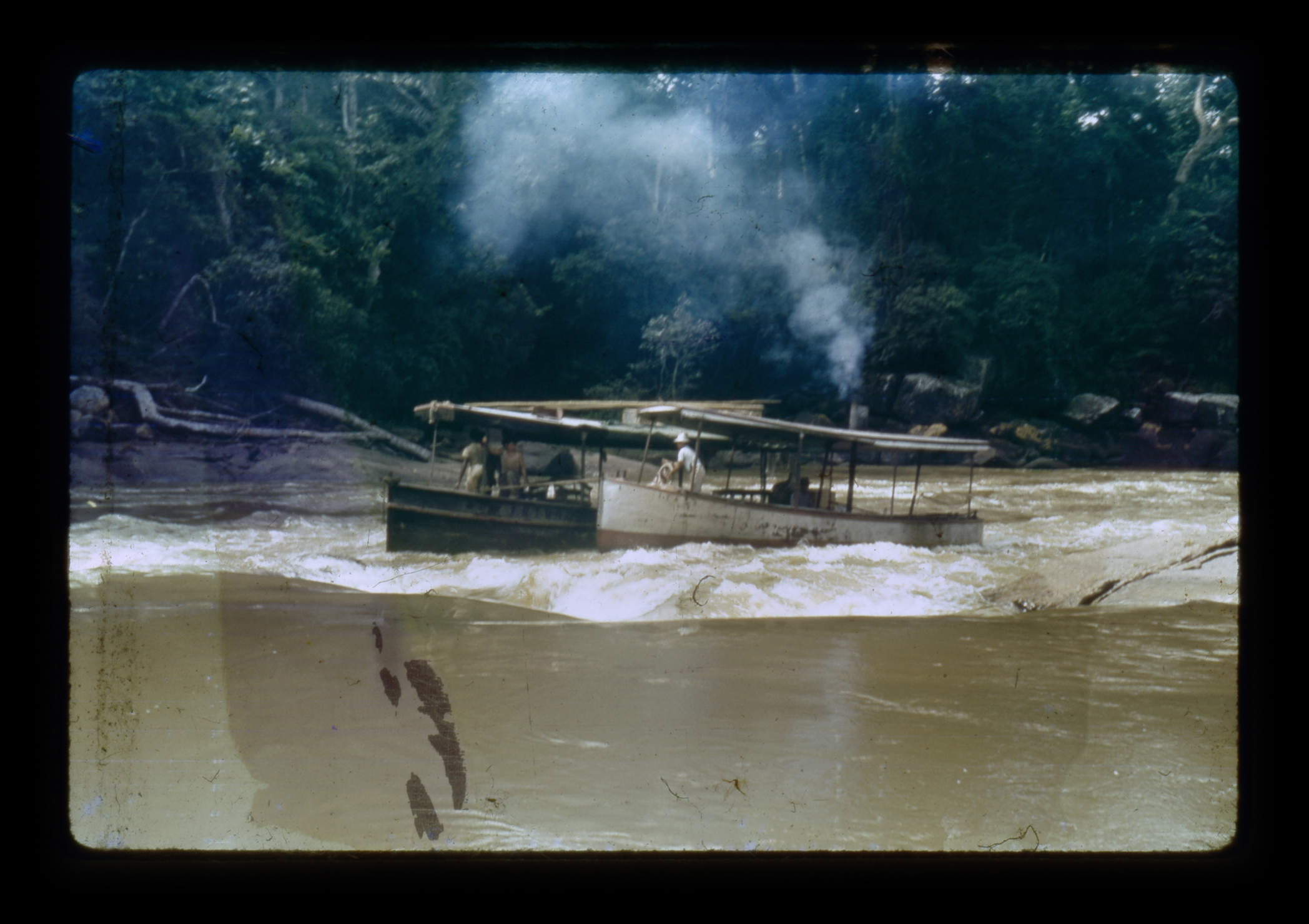  (research image) Untitled, Porto Velho, Brazil (1921-1952). Typed on verso: "R 8-10 Our launch &amp; batalau coming into swift set of rapids.” 35mm Kodachrome Slide. Creator: Cortland B. Manifold. Courtland Manifold Papers, Archival Services, Univer