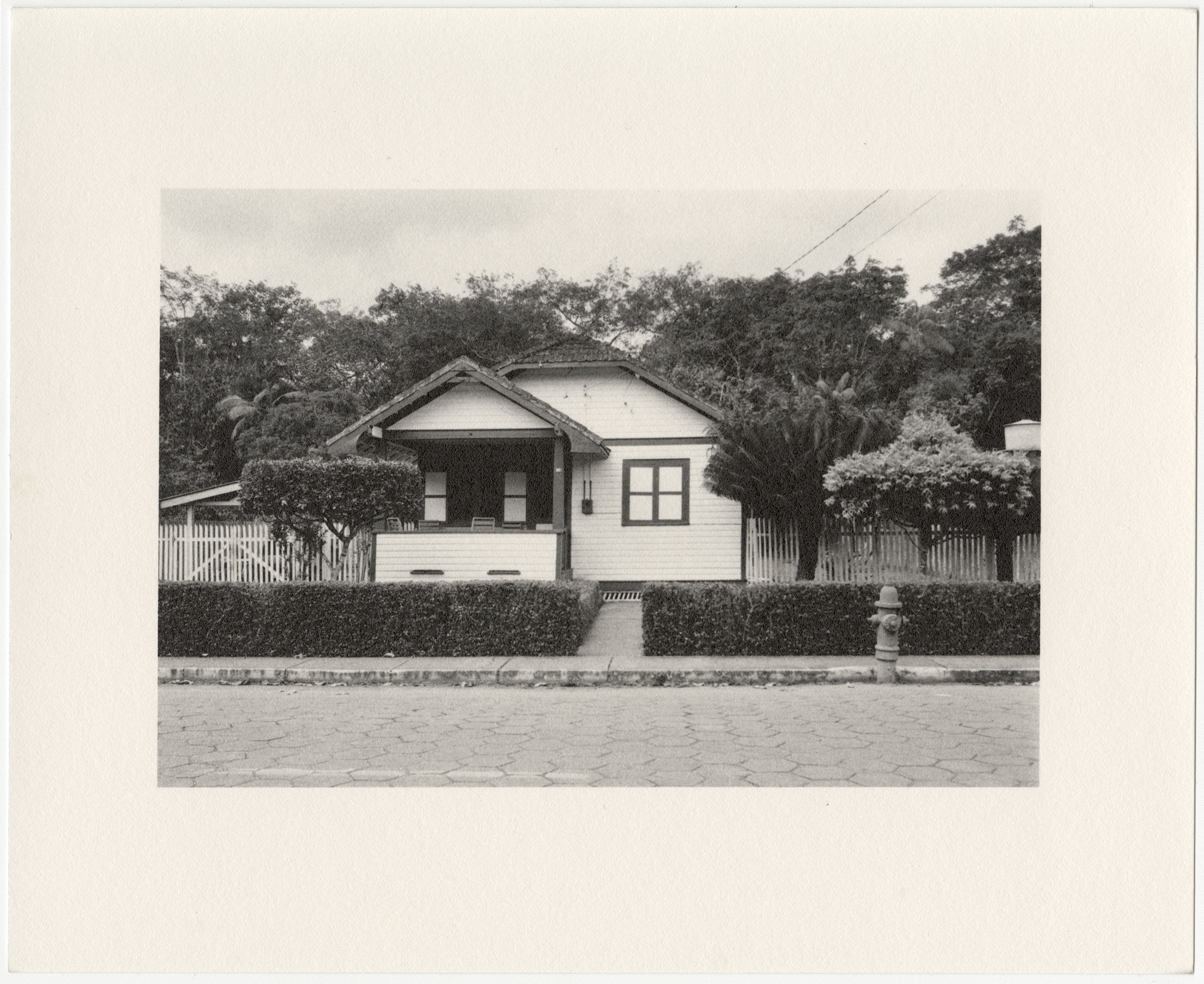  Belterra employee house with trimmed hedges and fire hydrant, built in 1934 by the Companhia Ford Industrial Do Brasil Ford Motor Company. 2014 Belterra, Pará, Brazil. Gelatin silver fiber print,  8” x 10”, 2014/2018 