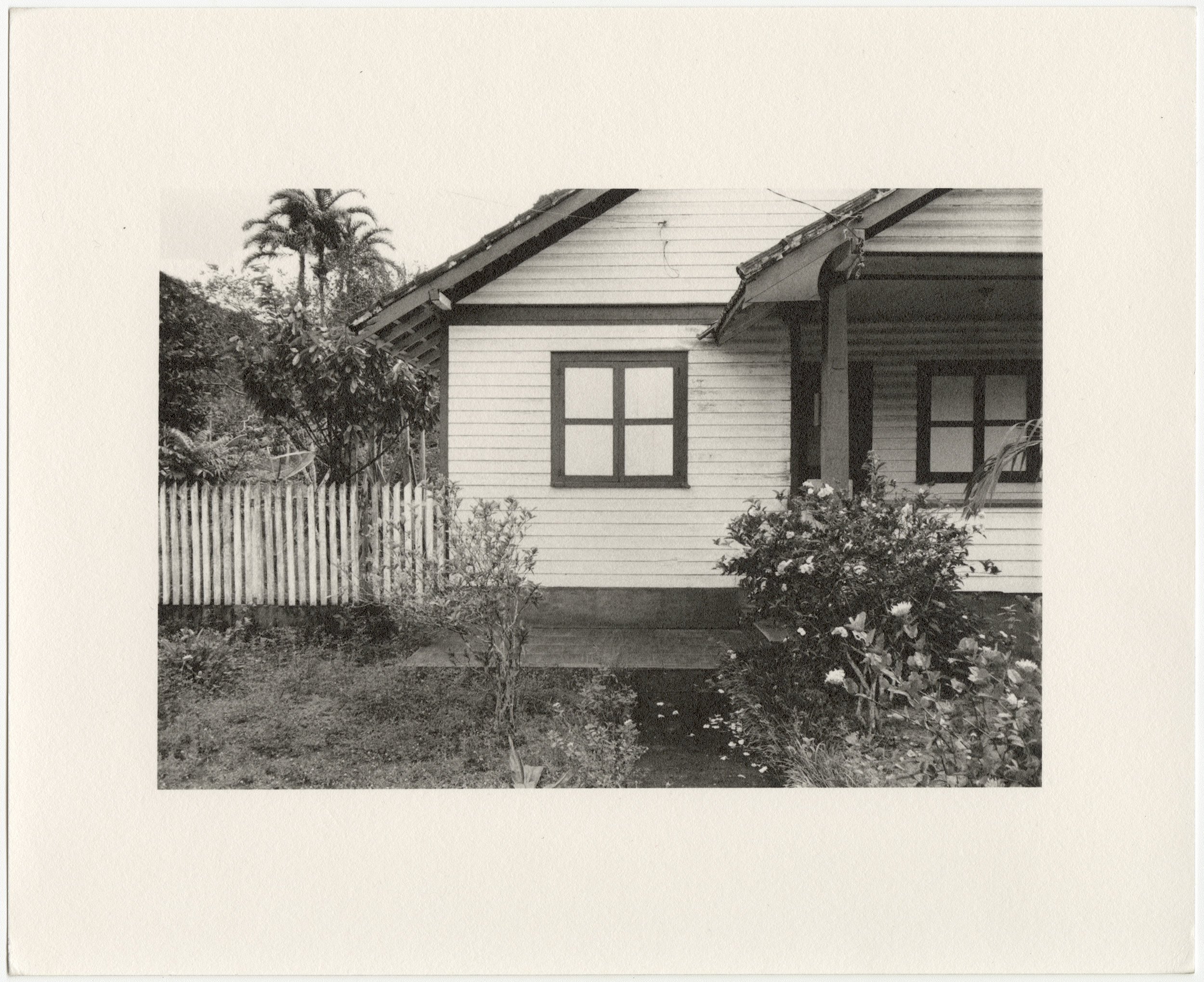 Belterra employee house with window and white picket fence, built in 1934 by the Companhia Ford Industrial Do Brasil Ford Motor Company. 2014 Belterra, Pará, Brazil. Gelatin silver fiber print, 8” x 10”, 2014/2018 