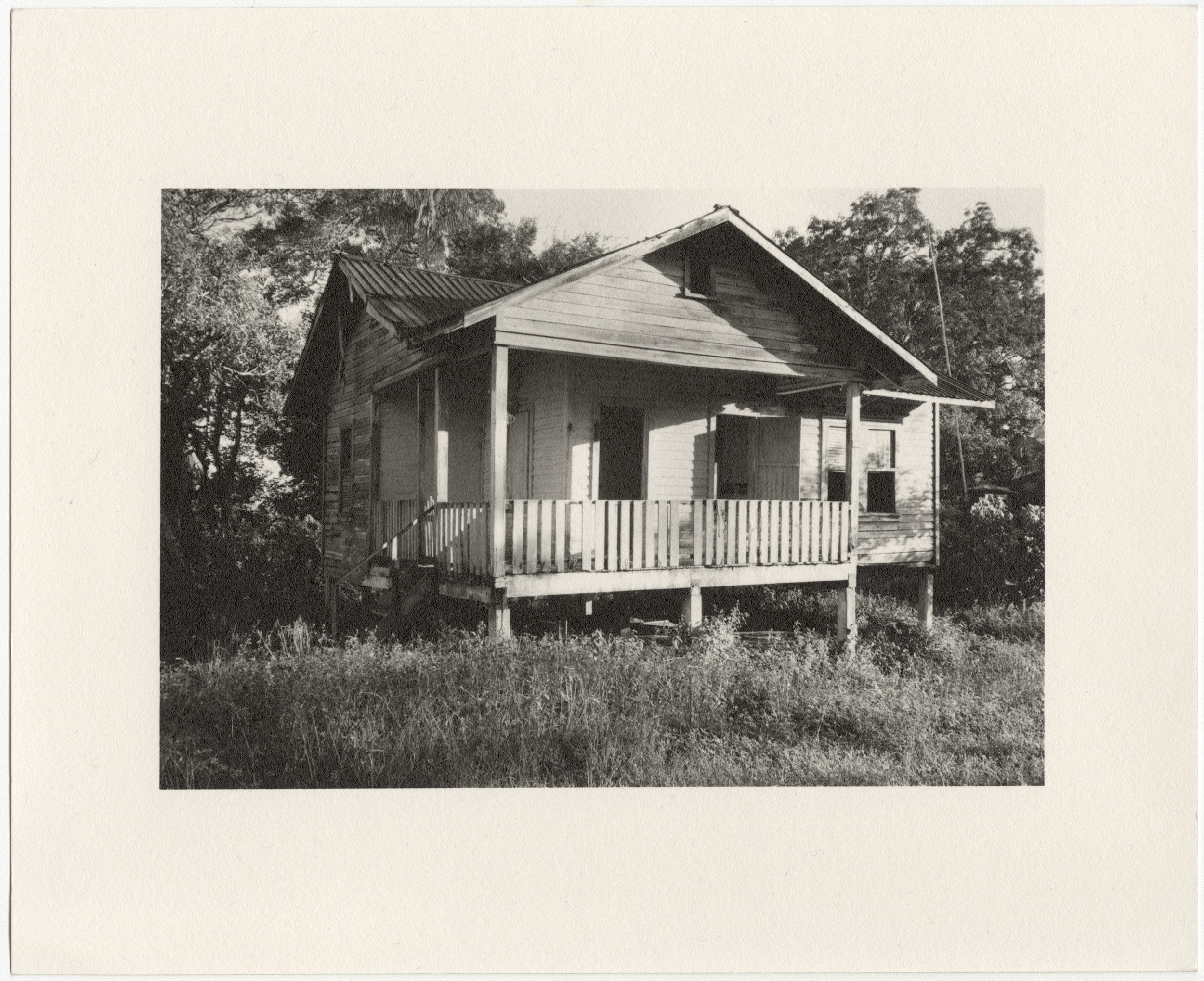  Fordlândia employee house with elevated front porch, built in 1929-1933 by the Companhia Ford Industrial Do Brasil Ford Motor Company. 2014 Fordlândia, Pará, Brazil. Gelatin silver fiber print, 8” x 10”, 2014/2018 