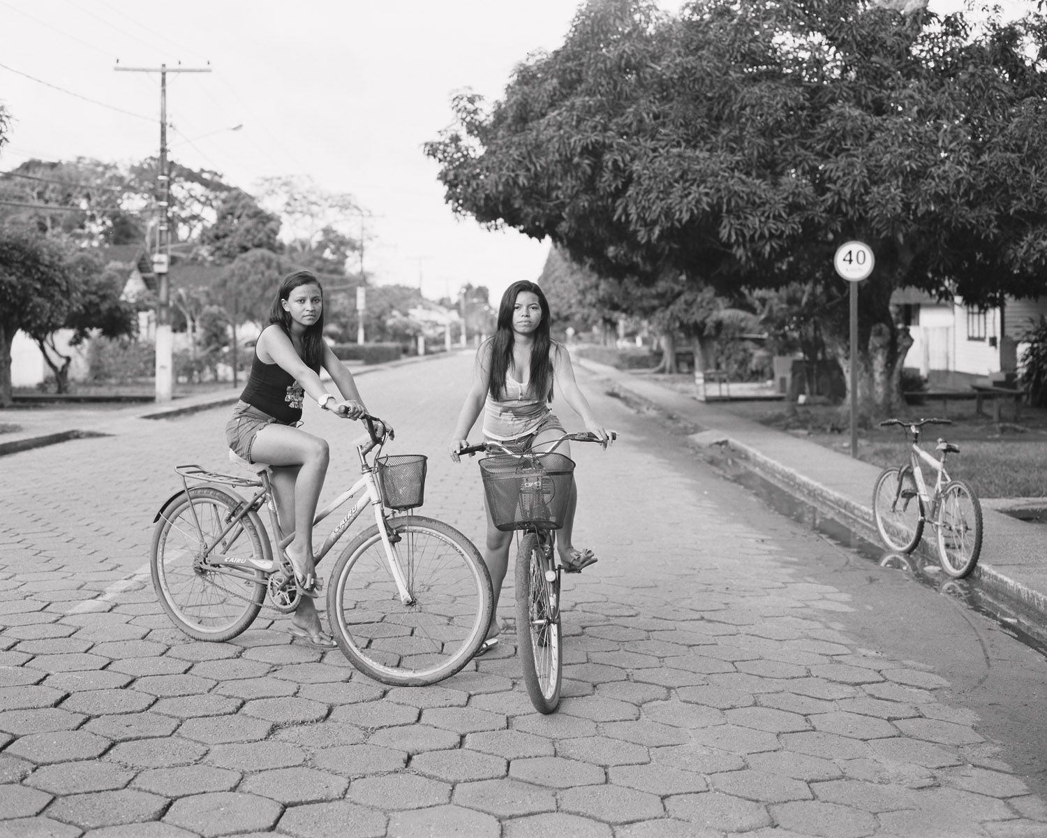  Nádhya Sophia and Loolinda Lee on bicycles, March, 2014, Belterra, Brazil. 2014/2018  