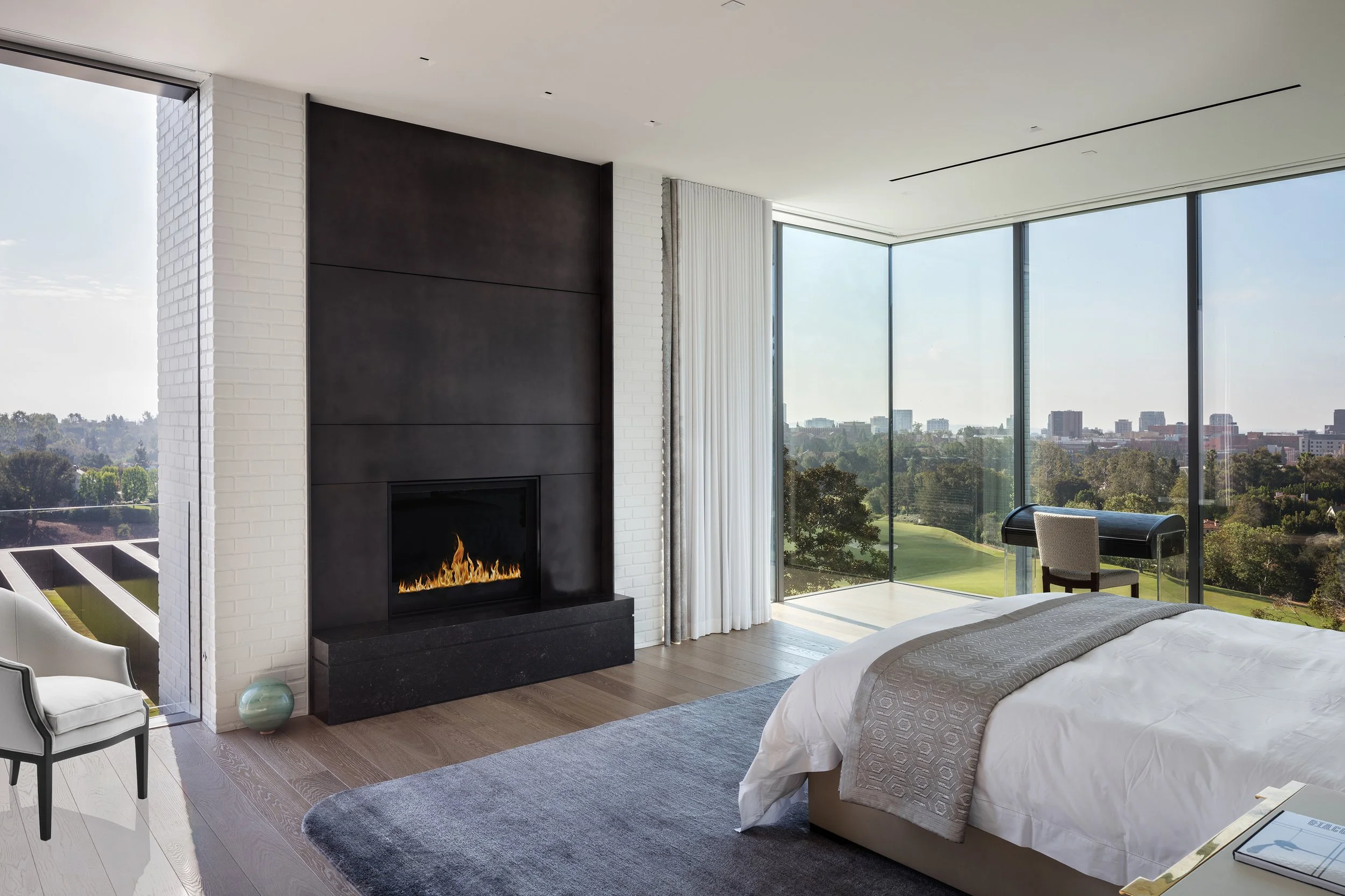 Fairway-Primary-Bedroom-View-Bronze-Fireplace.jpg