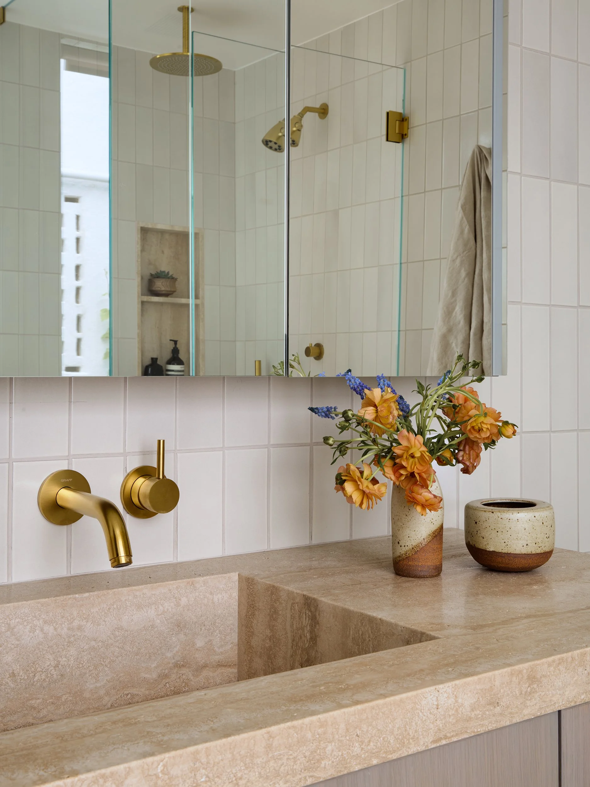 hollywood-hills-studio-aimee-less-bath-heath-oatmeal-brass-ceramics-flowers.jpg
