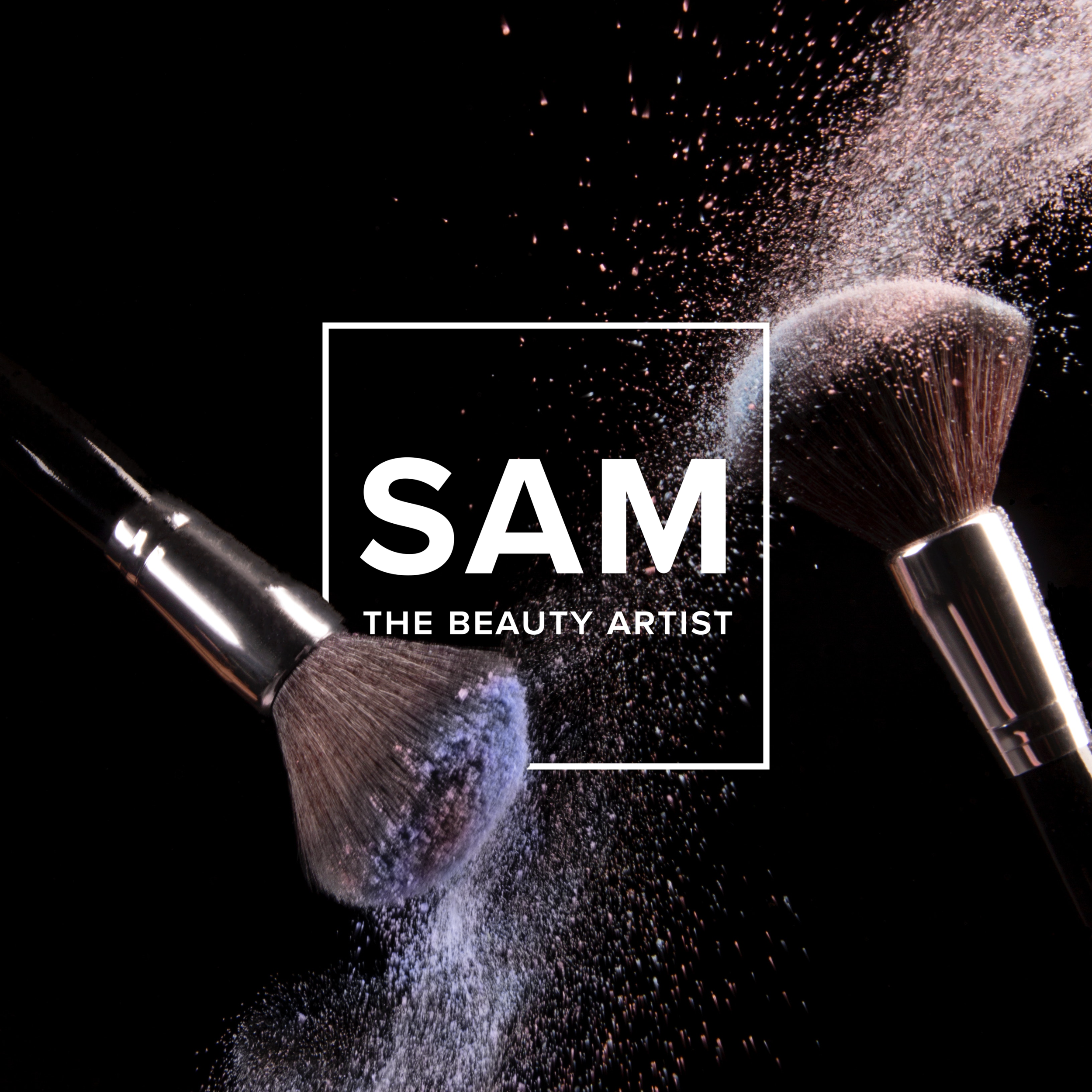 Close-up of a makeup brush with powder makeup dusting and spreading in the air. The background is black, and part of the word 'SAM' with the text 'THE BEAUTY ARTIST' is visible.