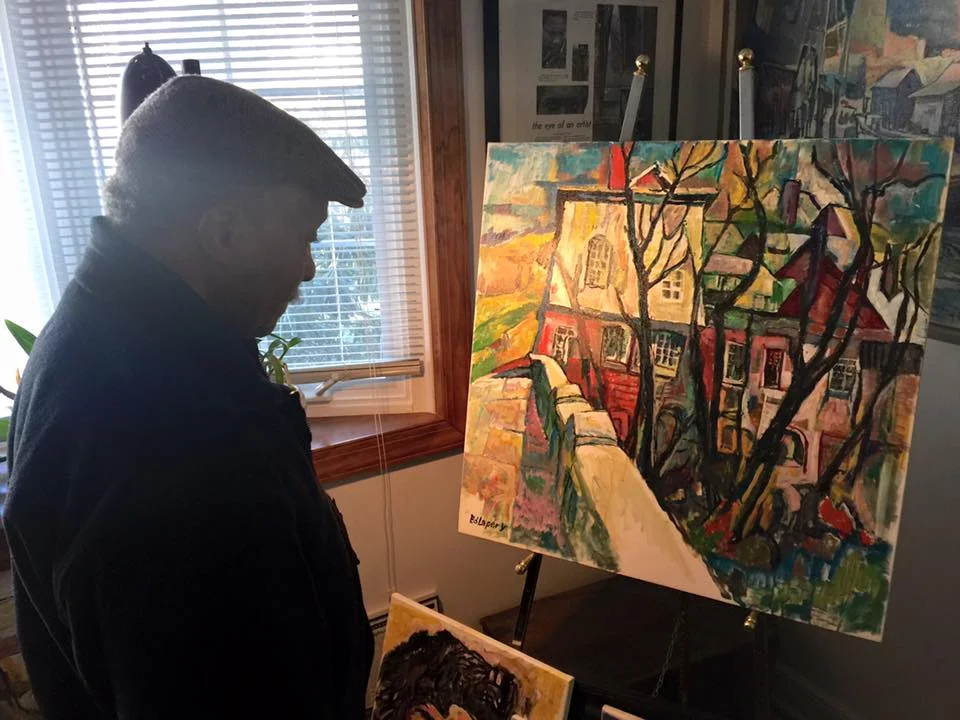 Edward examining a work in progress with the morning light.