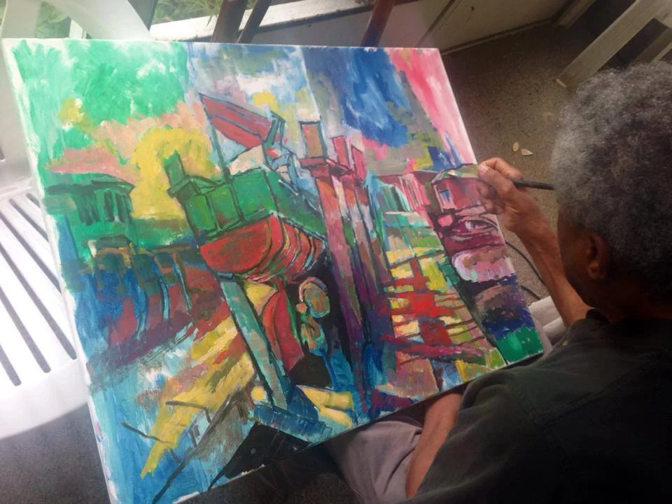 Edward works on the newly inspired work named "Booth Bay Harbor" at his home.