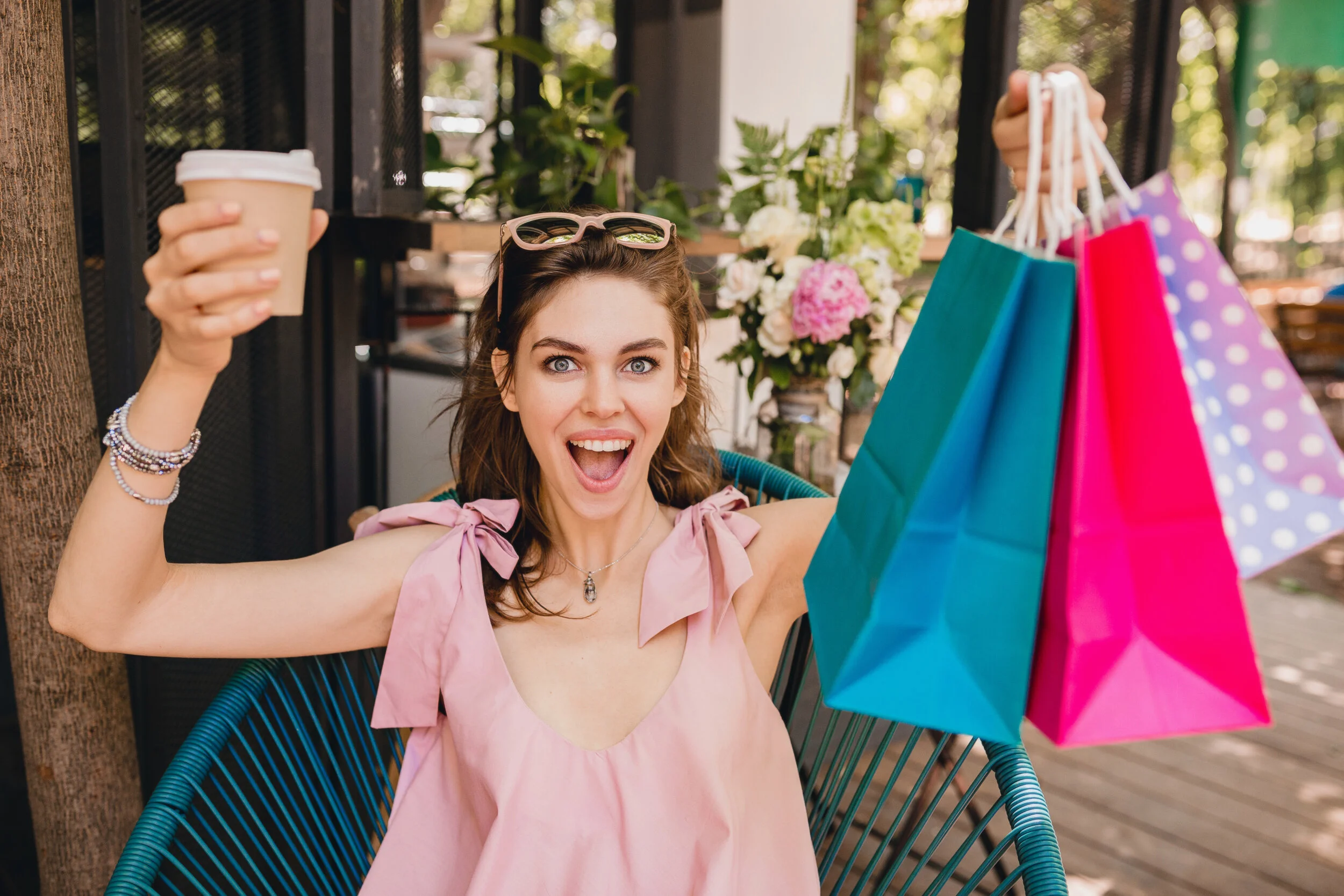 portrait-young-smiling-happy-pretty-woman-with-excited-face-expression-sitting-cafe-with-shopping-bags-drinking-coffee.jpg