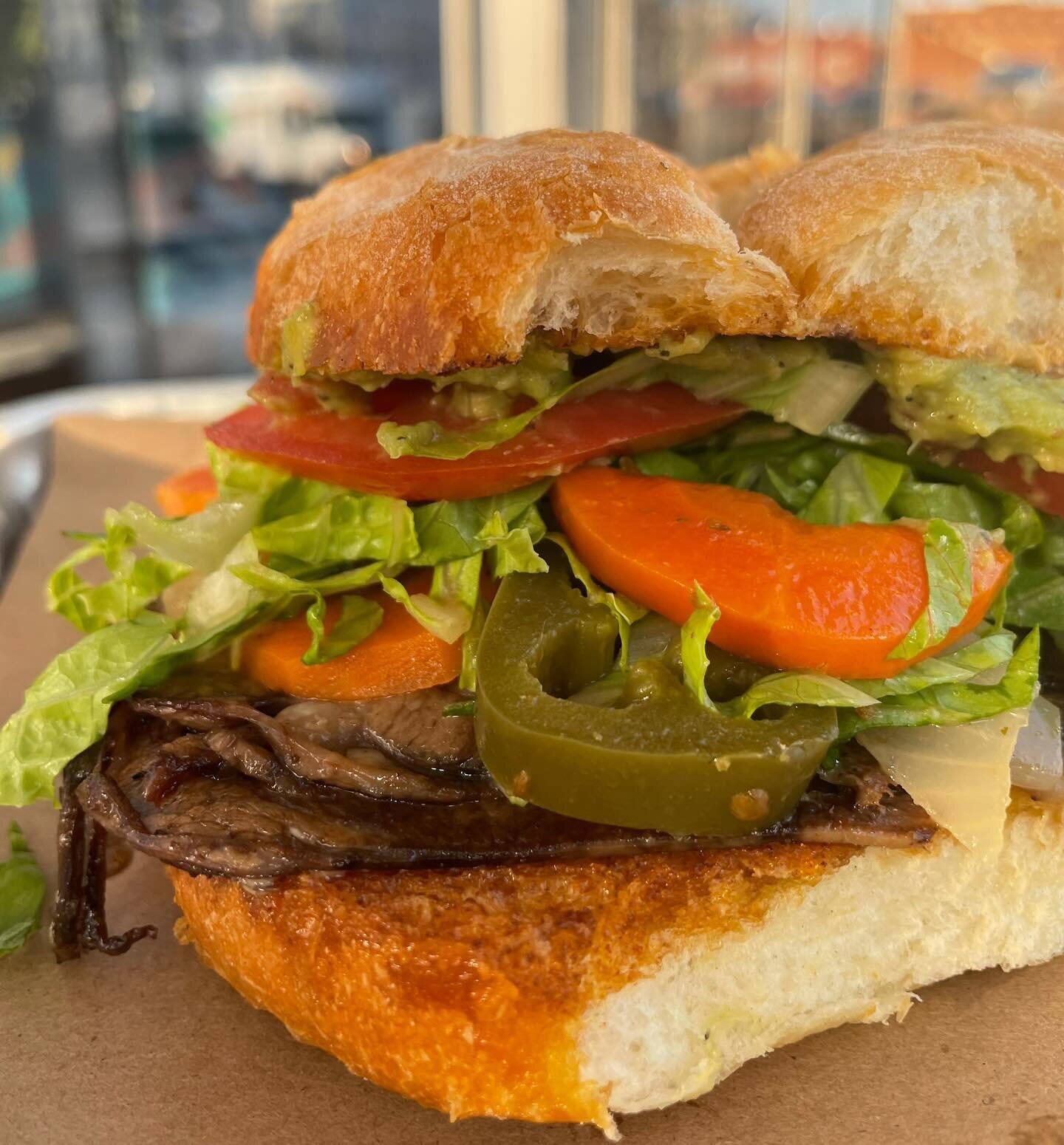 Torta de lengua: sliced &amp; seared beef tongue sandwich with a smear of guac, drizzle of Chipotle mayo, lettuce, tomato &amp; our mix of pickled vegetables, also known as escabeche. This will be our last weekend running this sandwich @porticobrewin