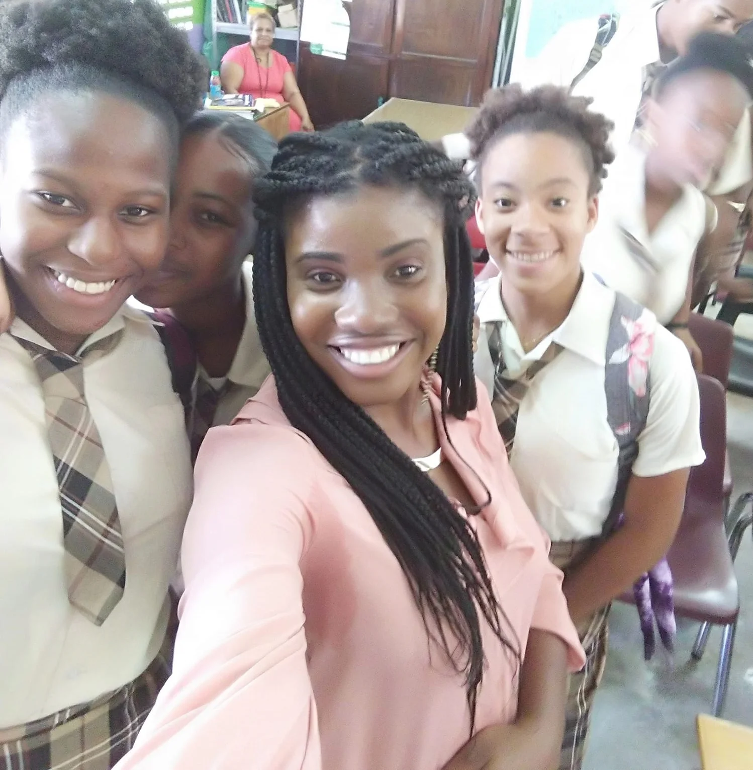 Crystel with a few students after presenting on Textiles, Clothing and Fashion Industries at her alma mater, Isaiah Thomas Secondary School.