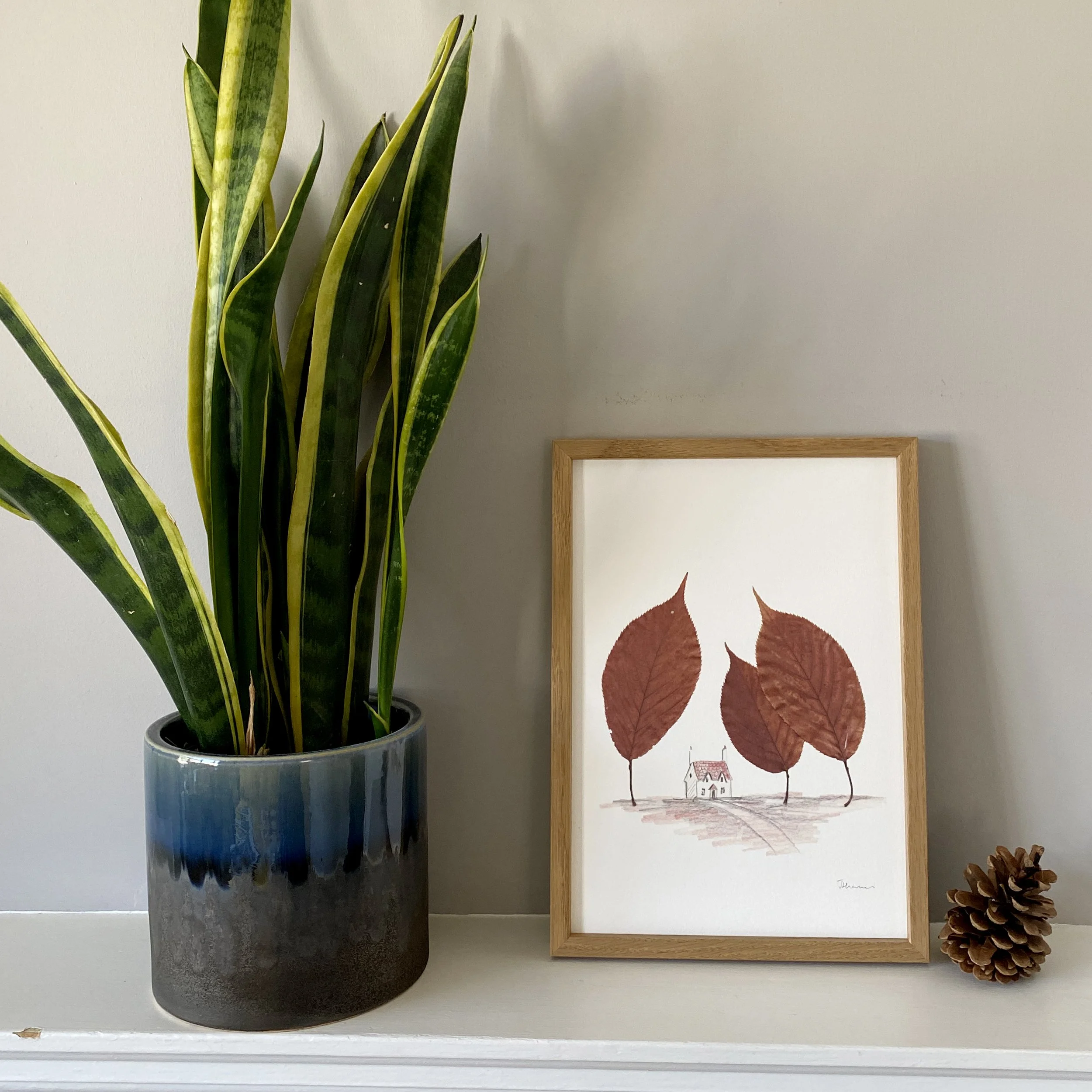 House in forest drawing with pressed leaves