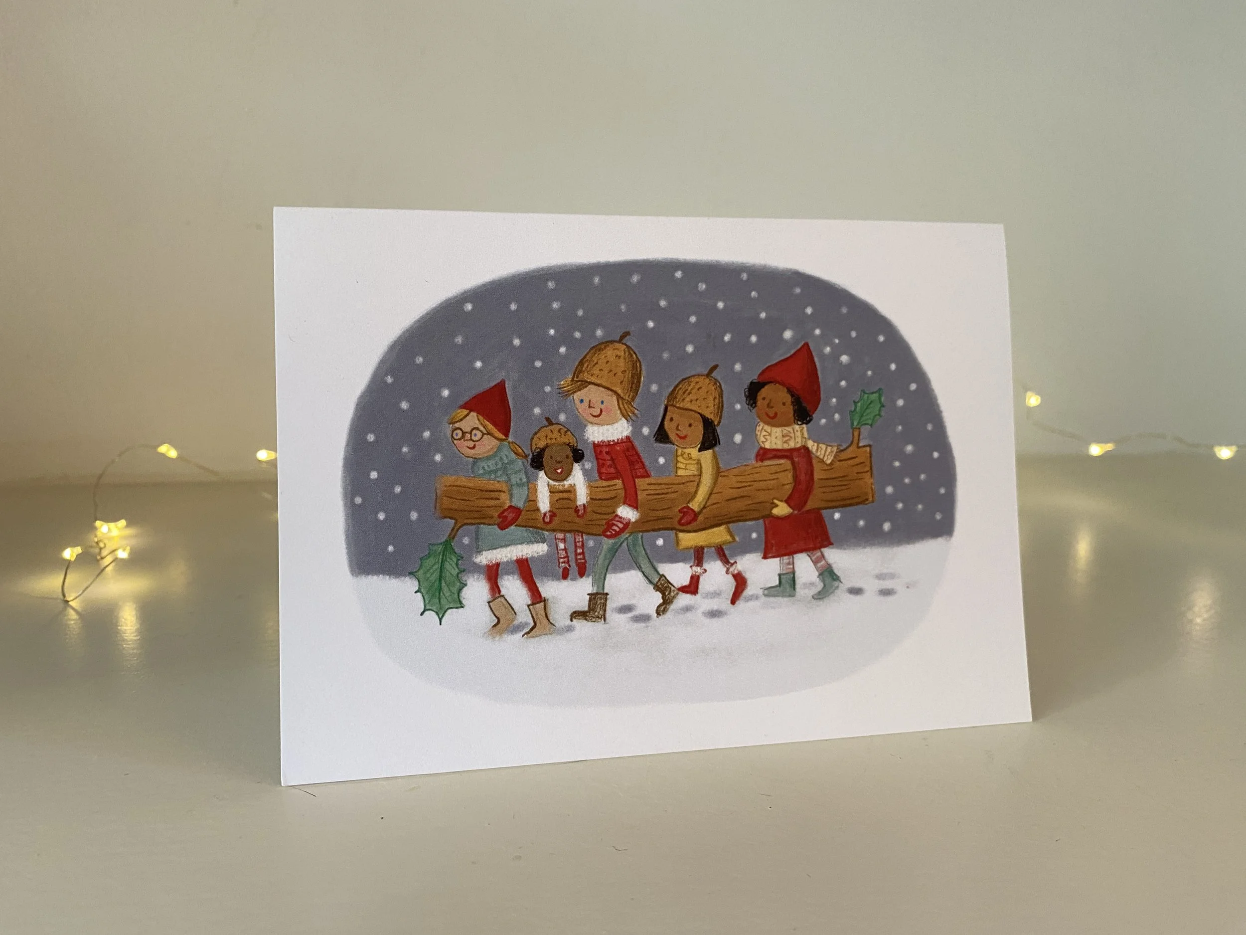 elves carrying yule log