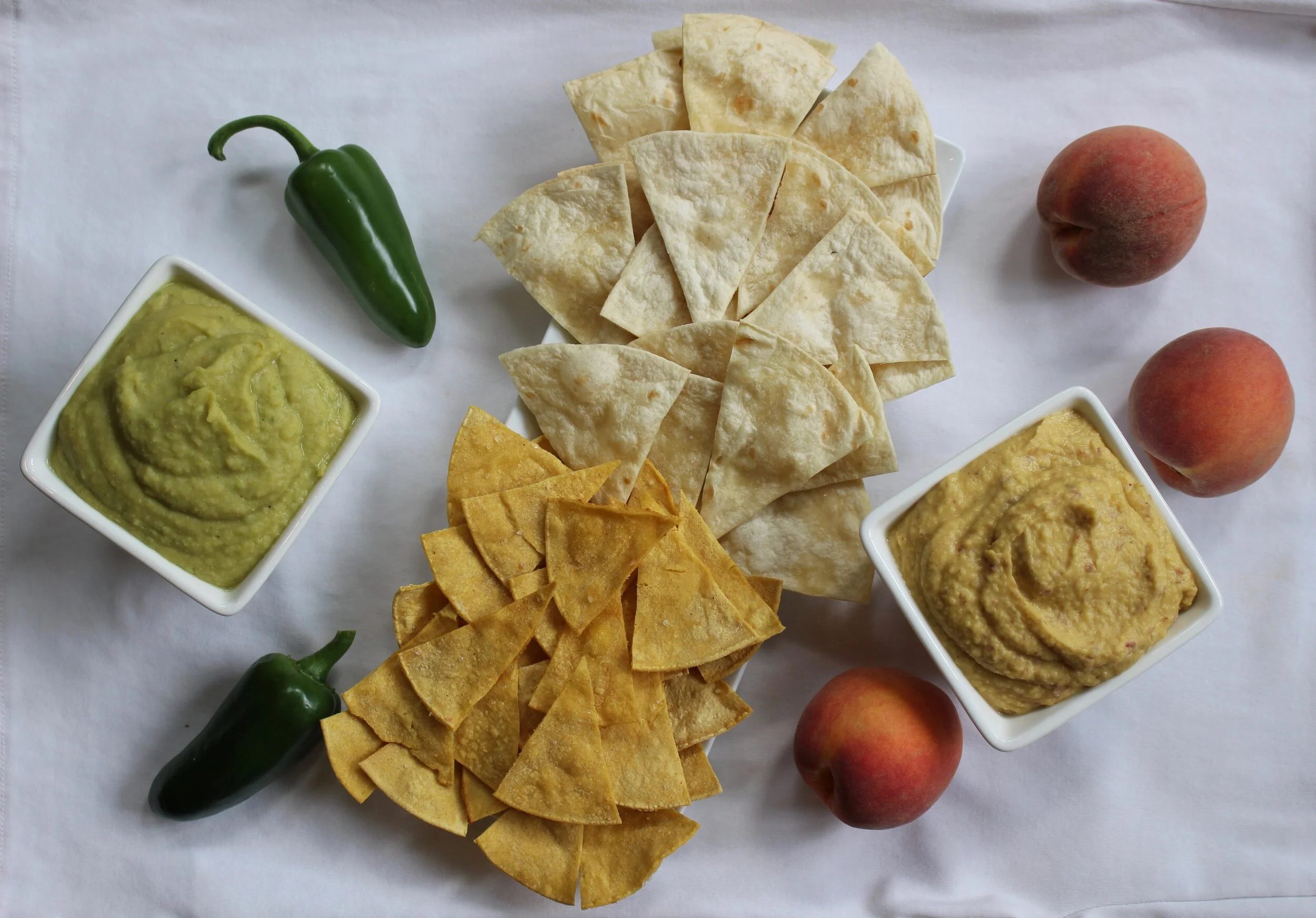 Spicy Jalapeño &amp; Green Chile Hummus, Sweet Peach &amp; Date Hummus, and Homemade Lime Tortilla Chips