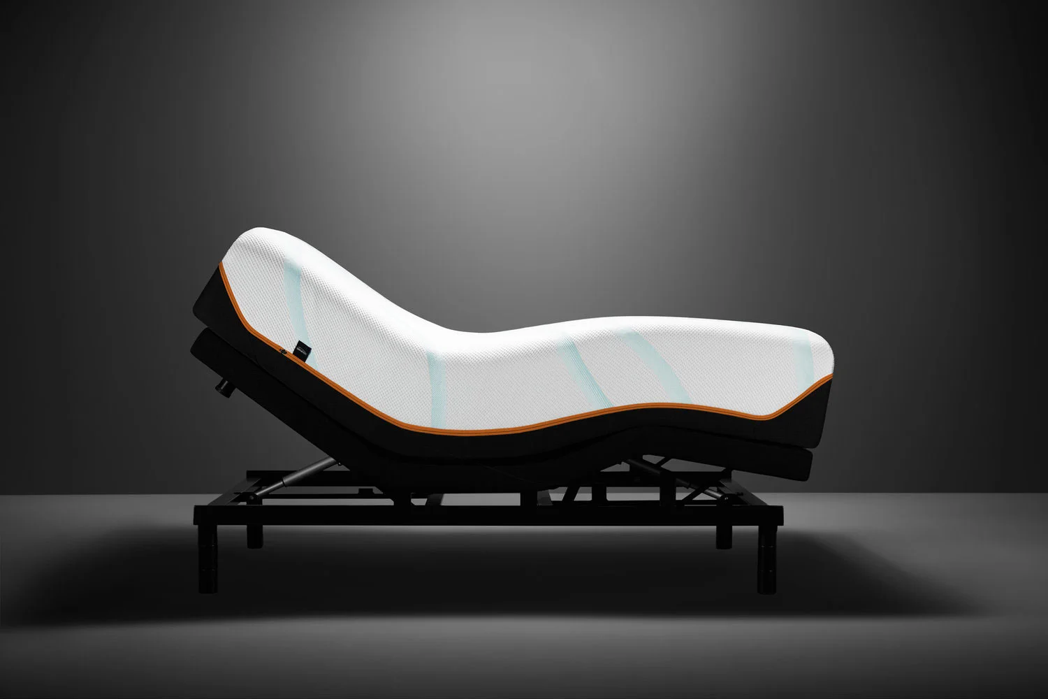 Picture of Tempur-Pedic Luxe Adapt firm mattress on adjustable base.