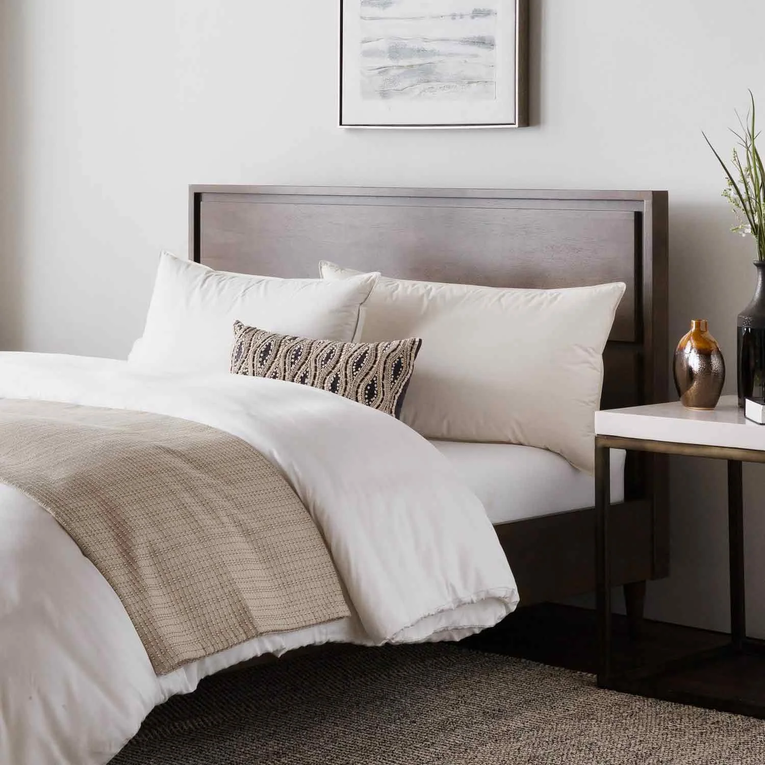 Picture of TripleLayer Down pillow on bed.